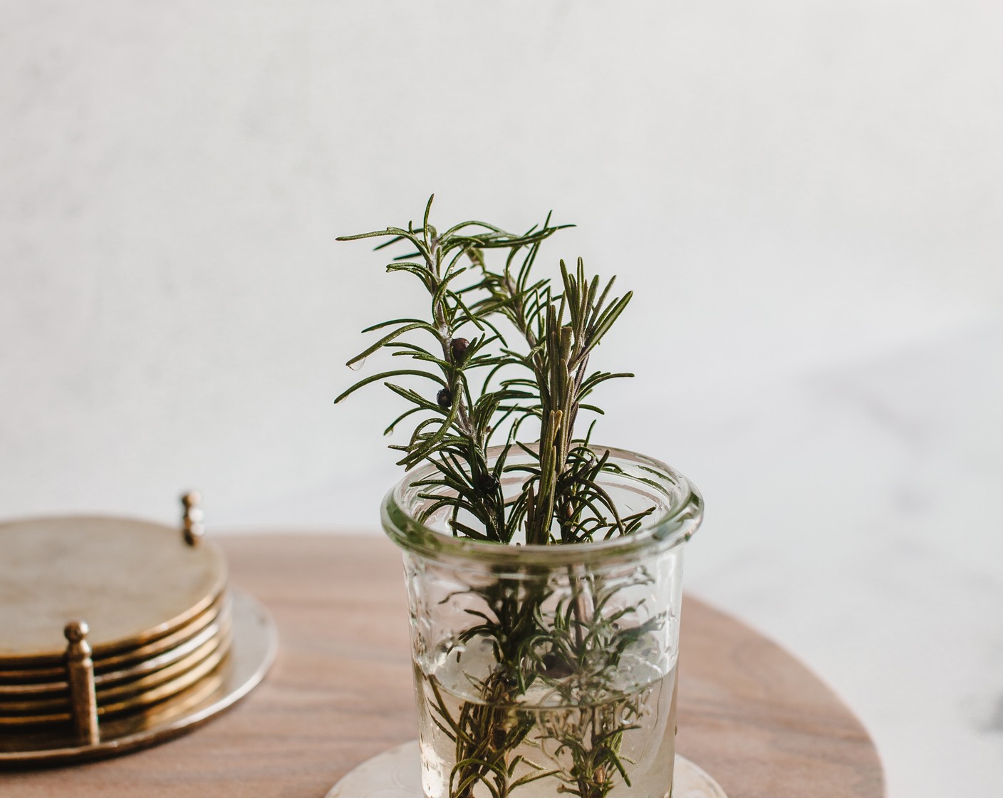 step 2 Add your Fresh Rosemary (2 sprigs) and Black Peppercorns (1 tsp) and let simmer for at least 20 minutes. I like to crush my rosemary with a spoon or spatula once it’s in the liquid to help release some of that flavor. Once completely cooled, pour into a sealable glass jar and set aside.