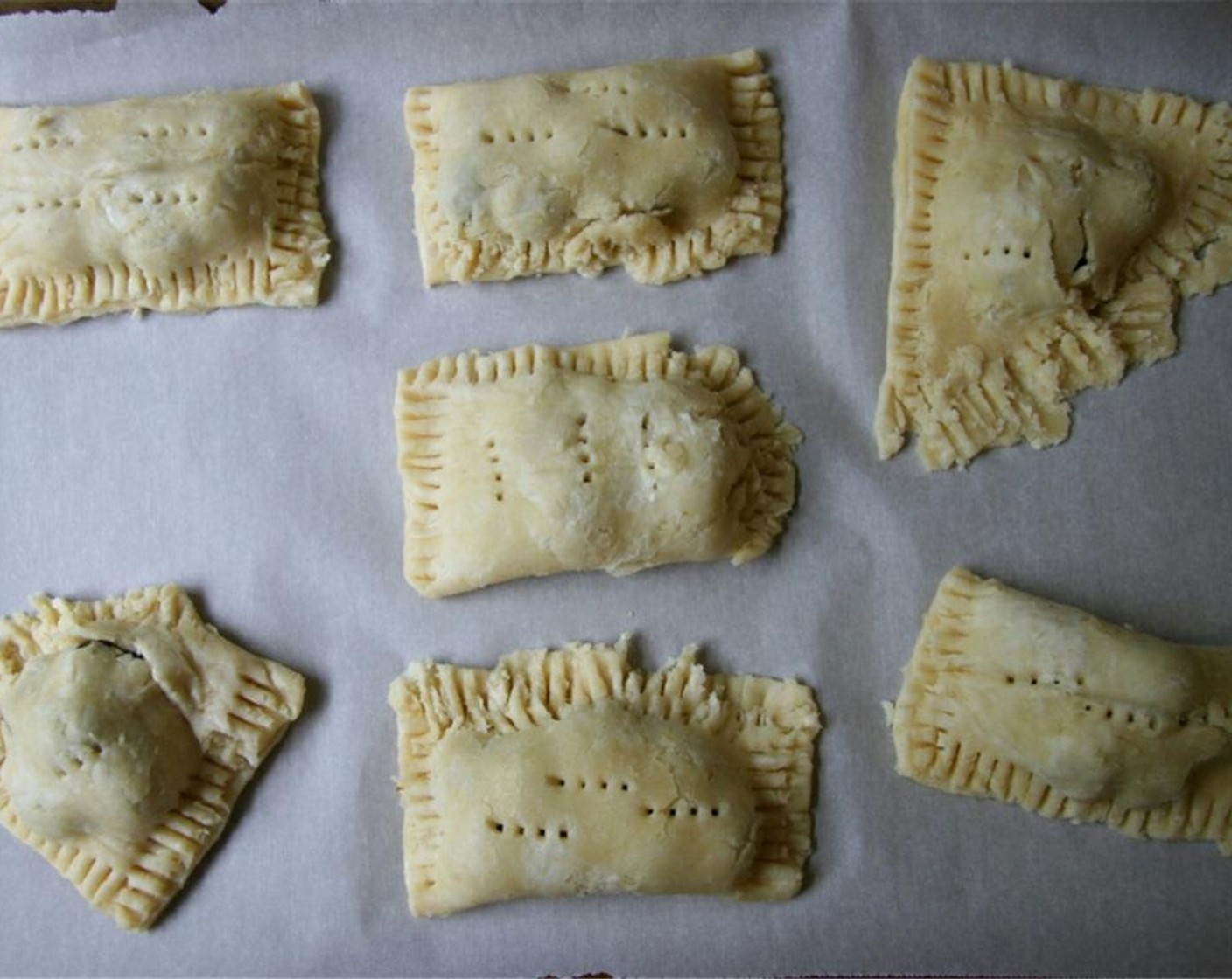 step 5 Roll out dough and cut into equal pieces. Place a tablespoon of filling onto each piece of dough. Fold in half and crimp edges with fork. Poke holes for steam to escape.