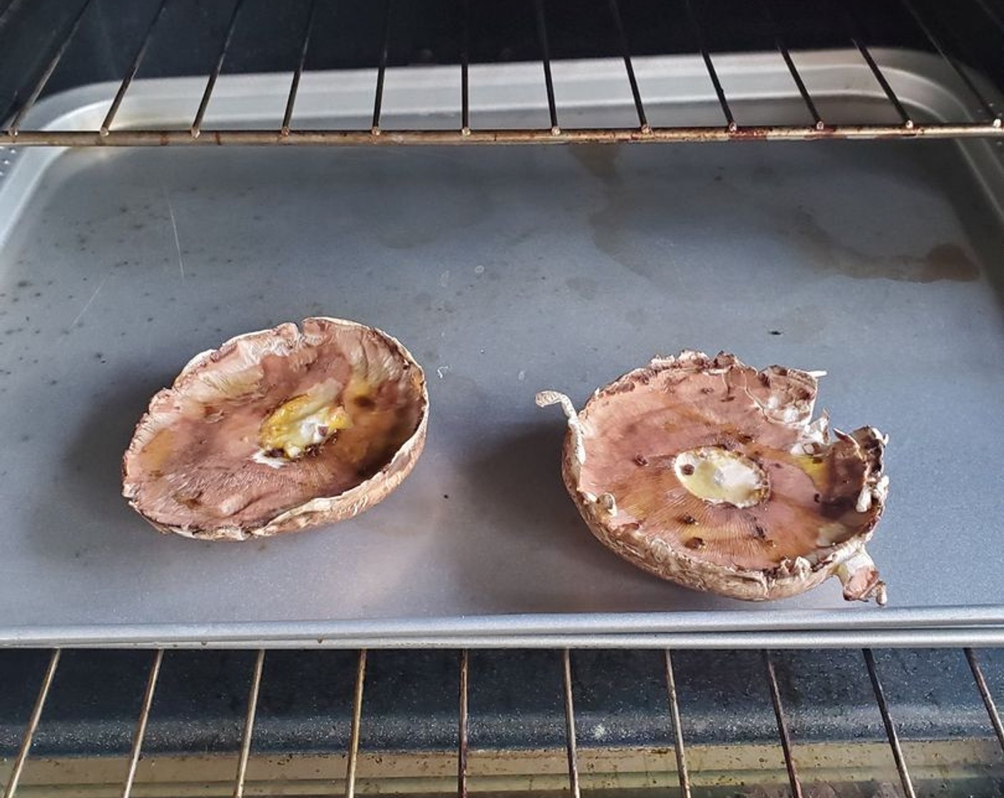 step 4 Place mushrooms top side down on the grill and cook for 25 minutes (mushrooms will shrink by about a third).