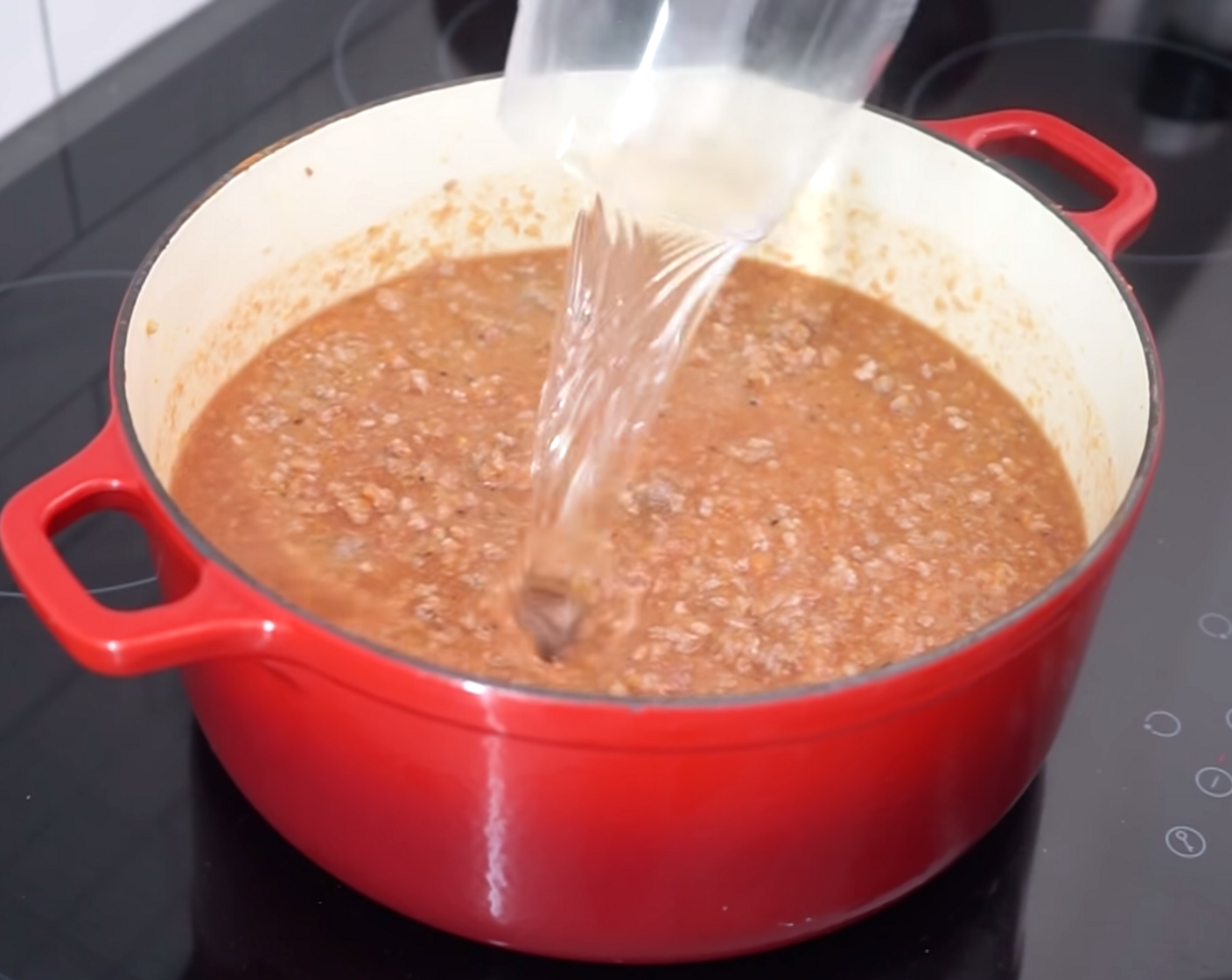 step 9 The final ingredient is 1 glass of water. Add the Water (8 oz) to your Bolognese sauce, mix through and cover, leaving it to cook for 30 minutes. Stir the sauce every 10 minutes so the meat cooks evenly and nothing sticks to the pan.