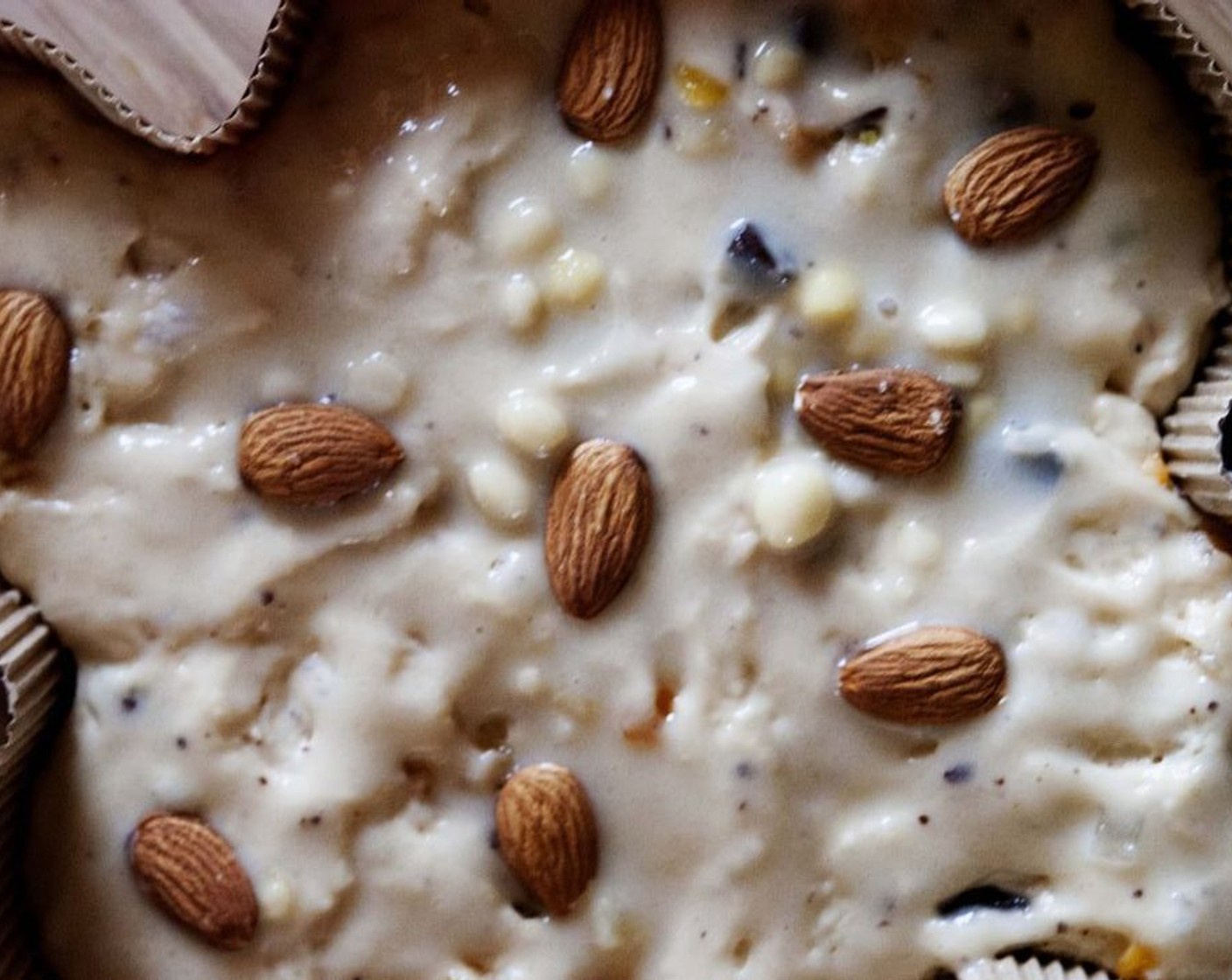 step 8 In a blender, blend white of the Eggland's Best Classic Eggs (2 2/3 Tbsp), Granulated Sugar (4 Tbsp) and Almonds (1/3 cup) until creamy. Brush that on top of the cake. And top it off with some more whole Almonds (to taste).