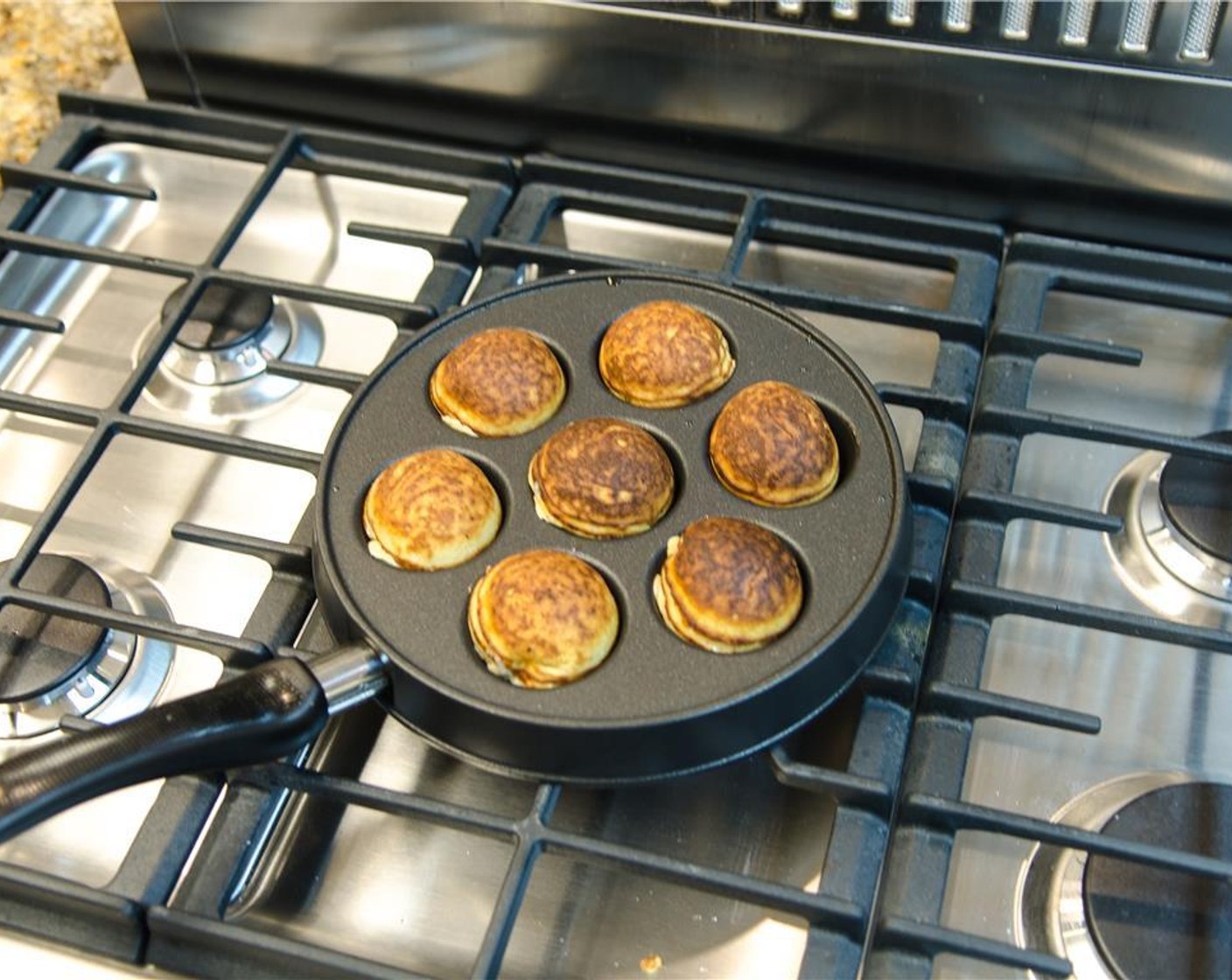 step 14 Continue to cook on the second side until browned and a tester inserted into the center comes out clean, about 1 minute.