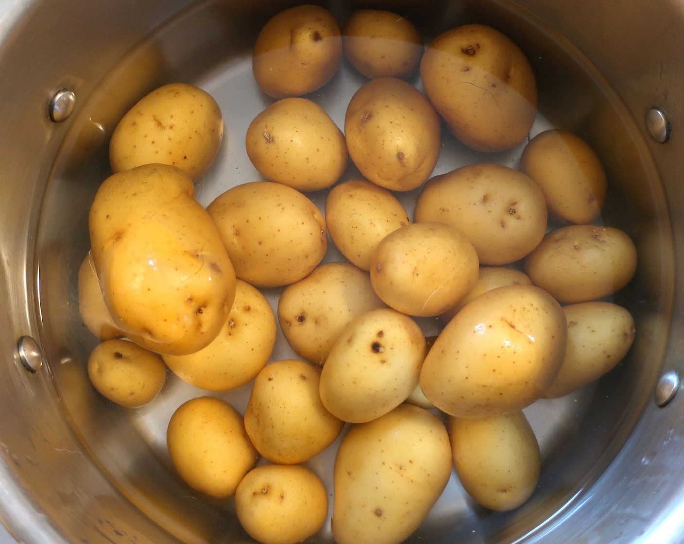 step 8 While the ribs are roasting, boil Potatoes (2 lb) until tender, drain, cut in halves.