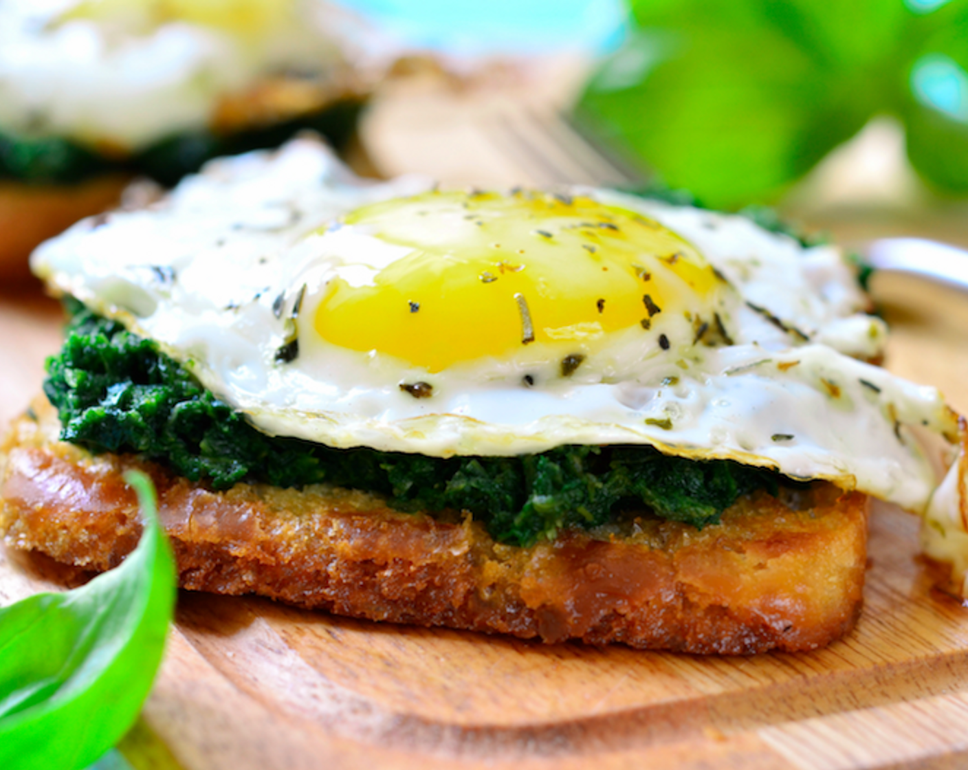 step 6 Top toasted Whole Wheat Bread (1 slice) with spinach and a sunny-side-up egg.