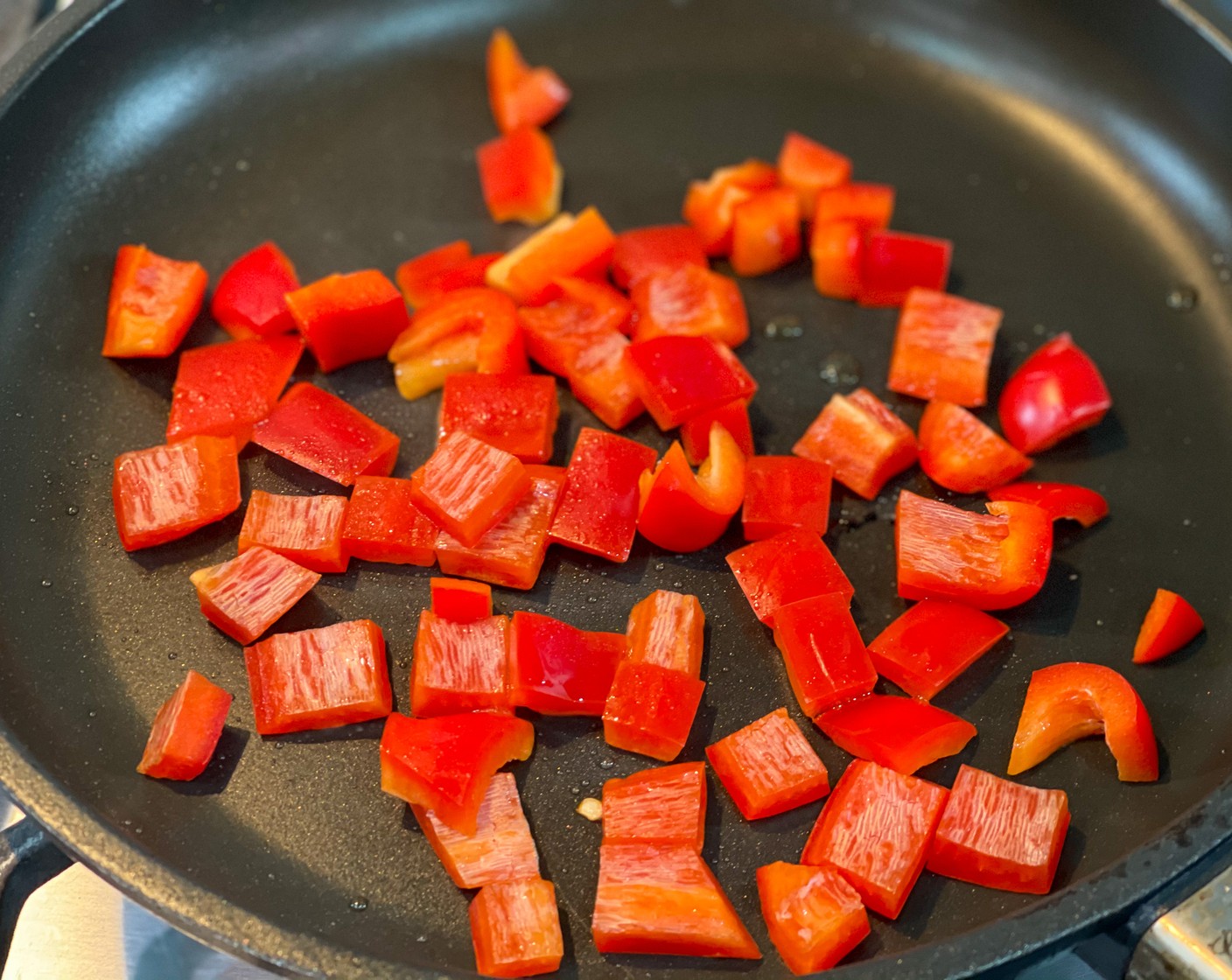 step 3 Heat Avocado Oil (2 Tbsp) in a 10-inch skillet over medium heat. Add Red Bell Peppers (4 Tbsp) and cook for 2 minutes stirring occasionally.