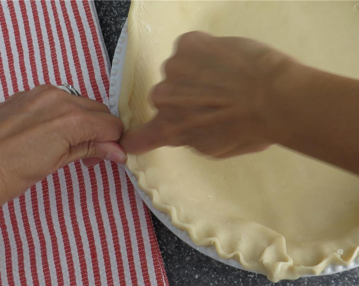 step 2 Place the 9-inch Pie Crust (1) into a glass or ceramic pie plate. Press bottom and sides into plate, and finish the edges of the crust by pressing the tines of a fork against the rim of the crust. Refrigerate crust until oven is preheated.