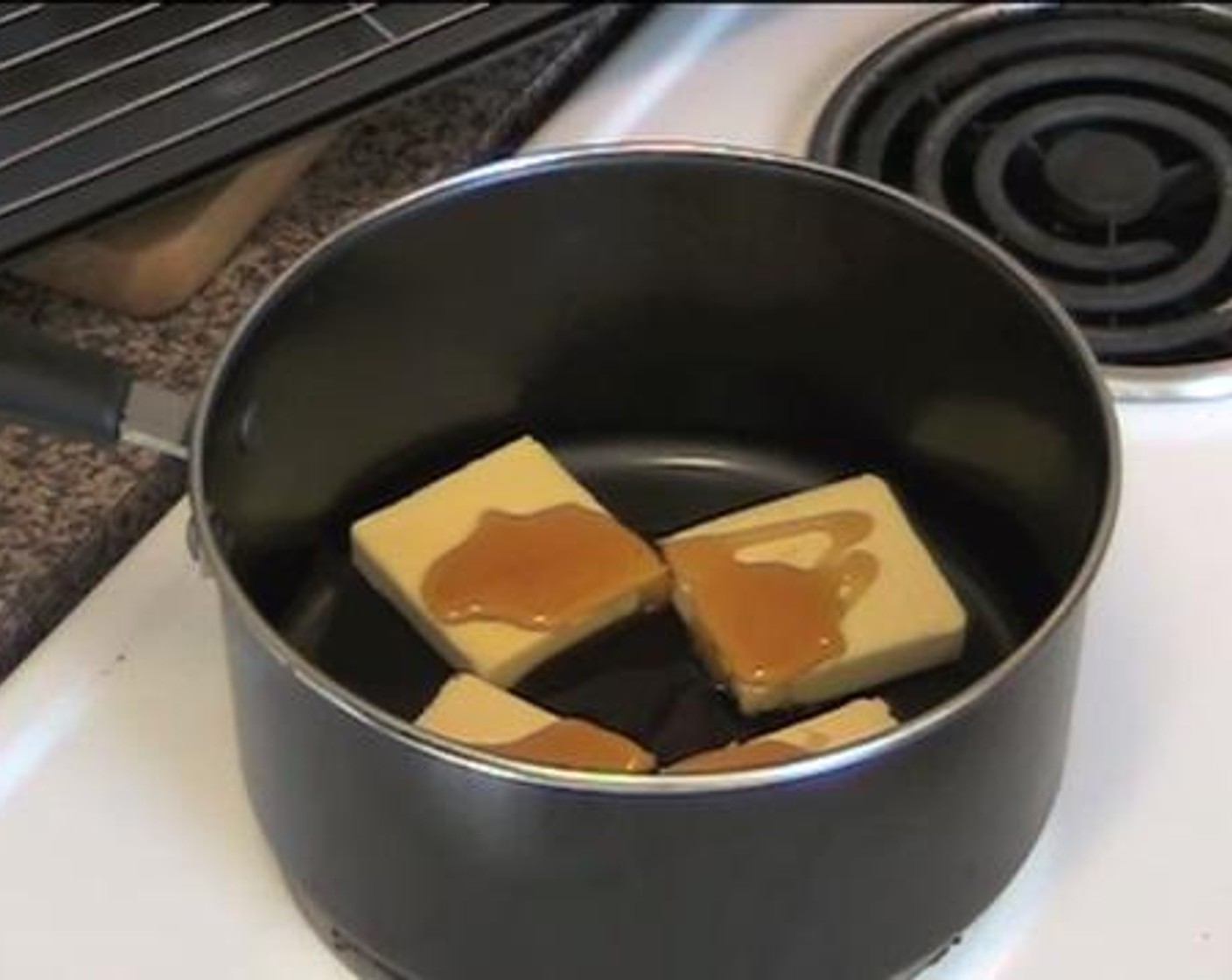 step 2 In a saucepan, melt together the Butter (4.5 oz) and Golden Syrup (2 Tbsp). Add in the Baking Soda (1/2 tsp) and Water (1 Tbsp) and stir everything gently.