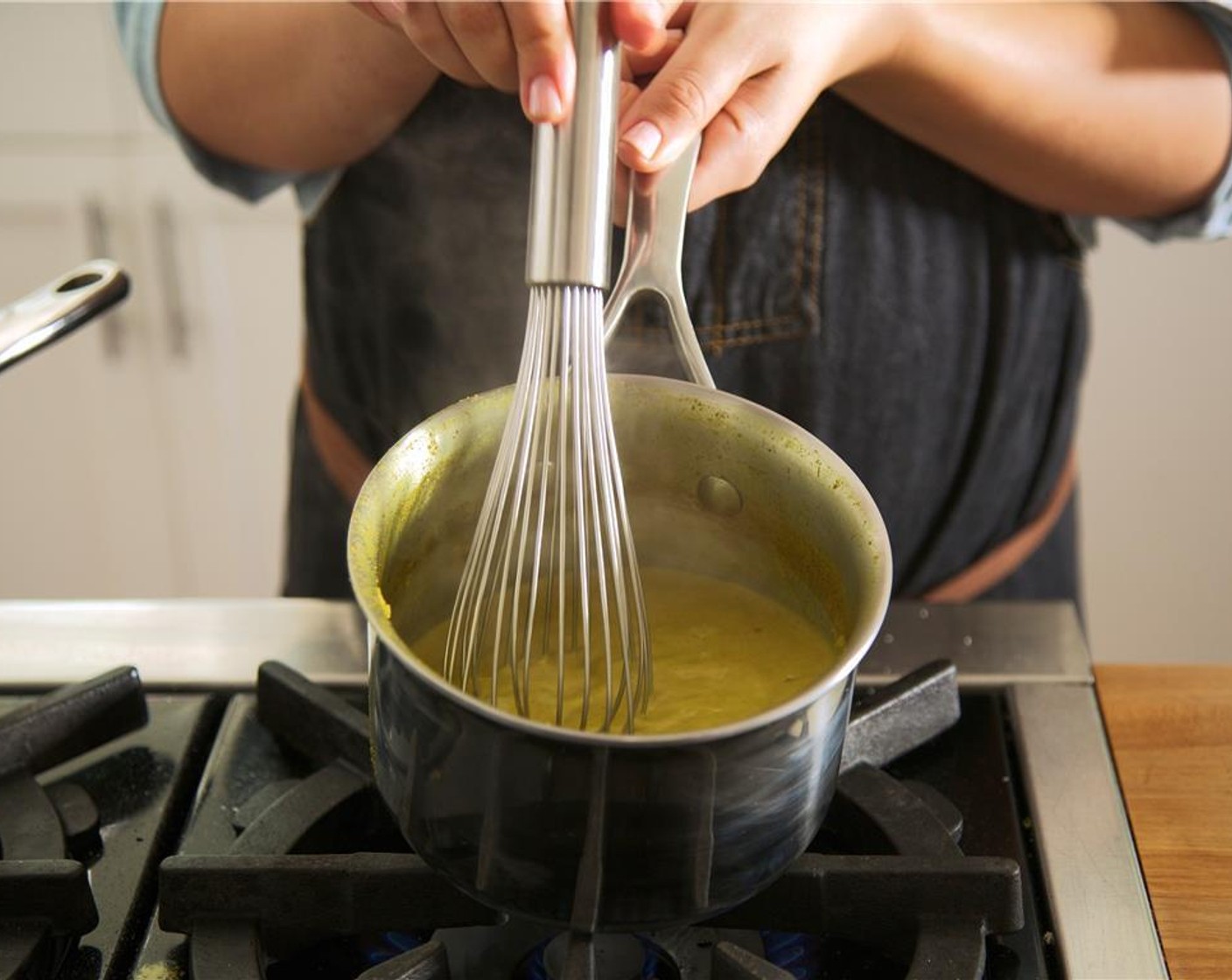 step 9 In a medium saucepan over medium heat, add Olive Oil (1 tsp). Add shallots and garlic cloves. Cook for 3 minutes, until softened.