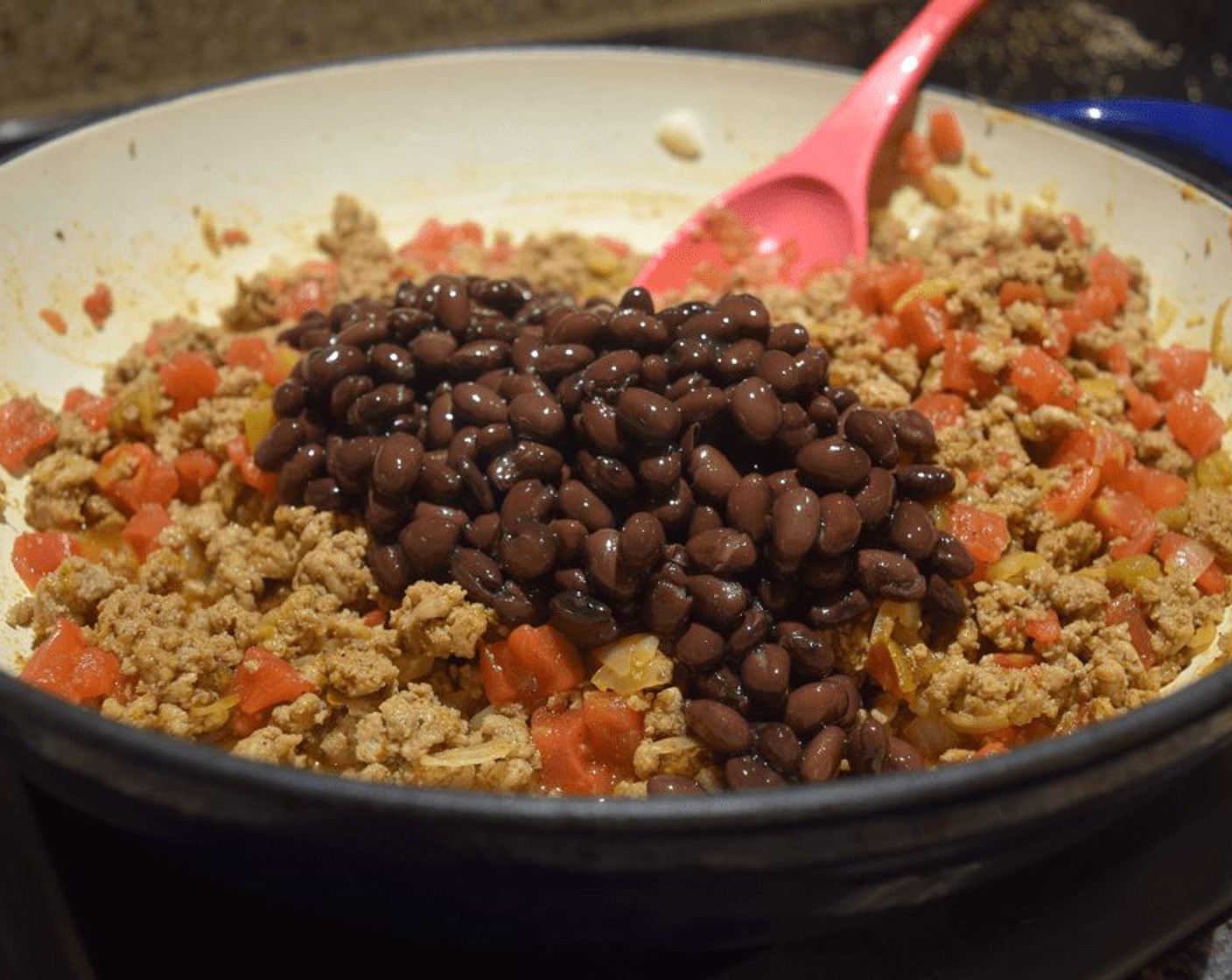 step 7 Stir in Diced Tomatoes with Green Chilies (1 can) and Black Beans (1 can), then stir in the quinoa. Remove from the heat, and then stir in half of the Monterey Jack Cheese (1/2 block).
