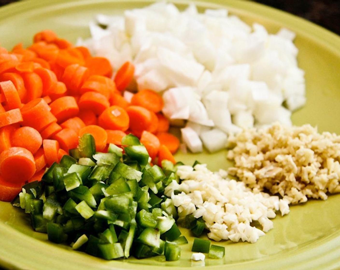 step 3 Dice the Carrot (1 cup) and the Onion (1/2). Mince the Garlic (2 cloves). Finely chop the Fresh Ginger (1 in) and jalapeño pepper.