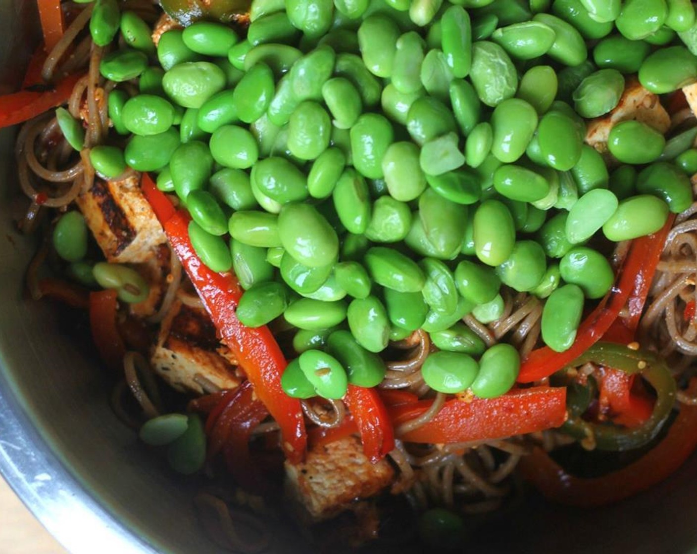 step 8 Transfer the noodles into a large bowl to toss with the Edamame (1 cup), Green Cabbage (2 cups), and Scallion (1/4 cup).