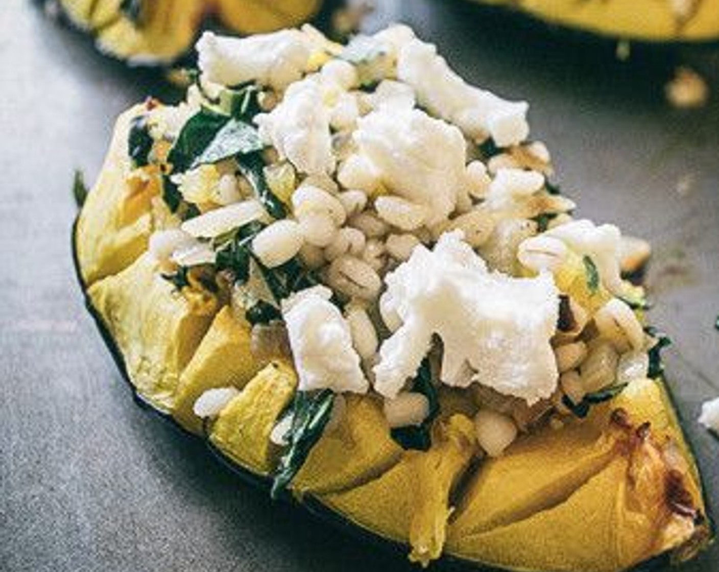 step 7 Stir the cooked squash with the barley and veggie, then spoon the mixture back into squash quarters and top with Goat Cheese (2 Tbsp).