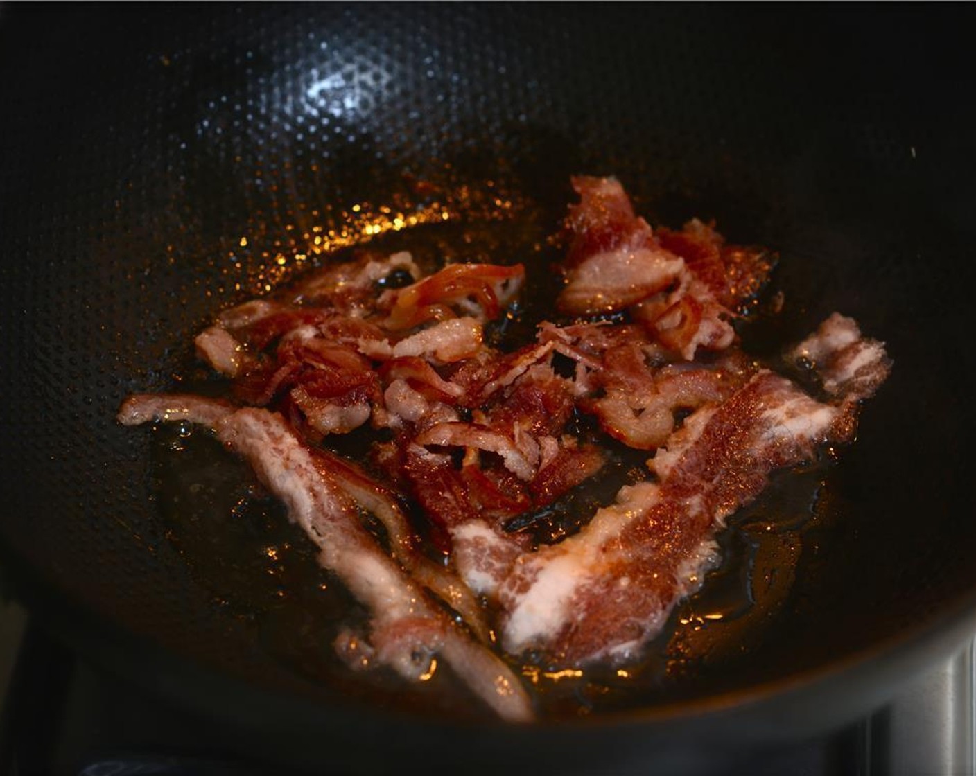 step 1 In a large Dutch oven or heavy bottom wok, cook the Bacon (6 slices) over low heat. Once the bacon is done, set it aside on a plate lined with a paper towel to cool. Once cooled, chop or crumble the bacon. Reserve the fat in the pan.