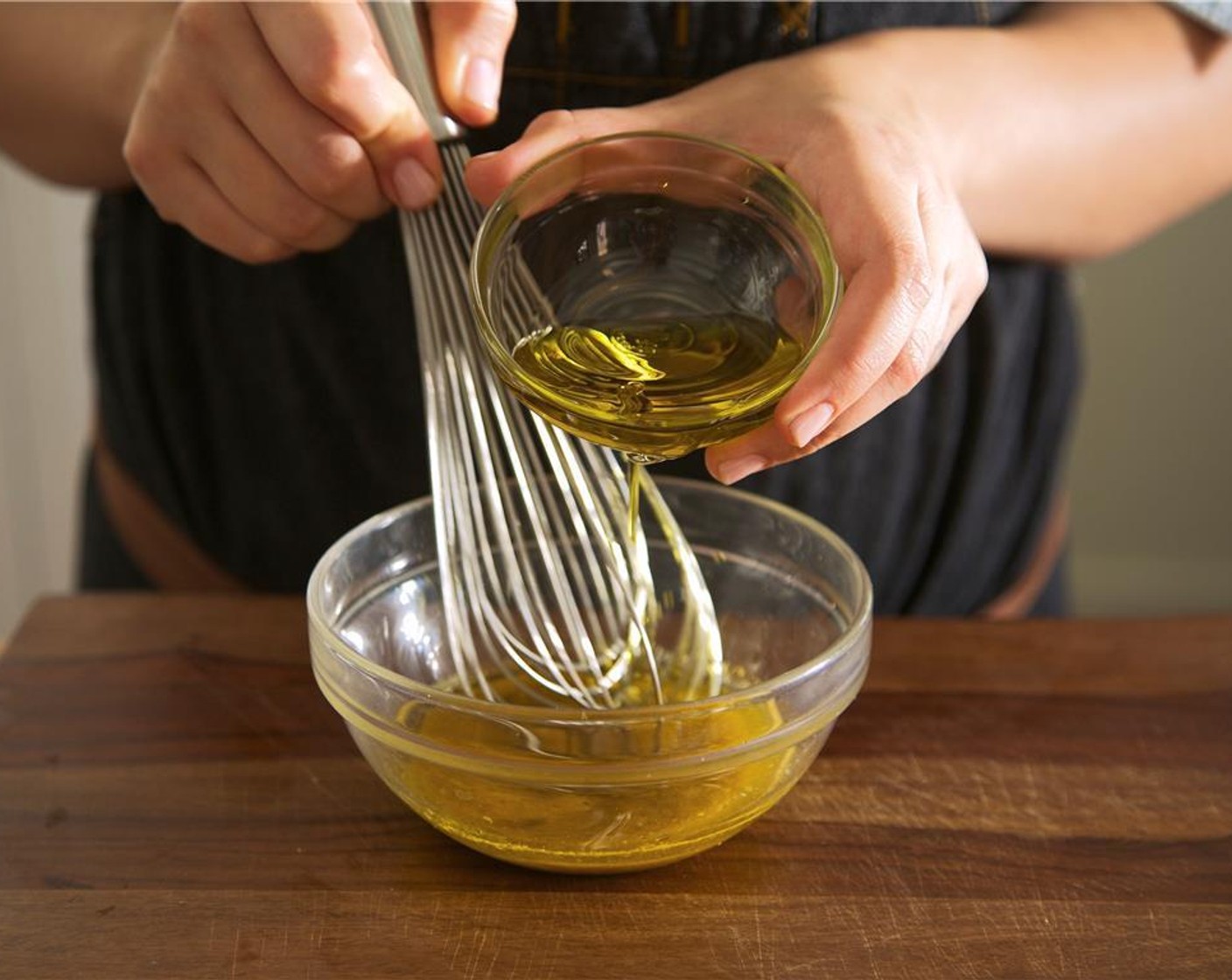 step 8 Slowly pour Olive Oil (4 Tbsp) into the bowl, whisking constantly, until the oil is incorporated into mixture. Season with Salt (1/4 tsp) and Ground Black Pepper (1/4 tsp).