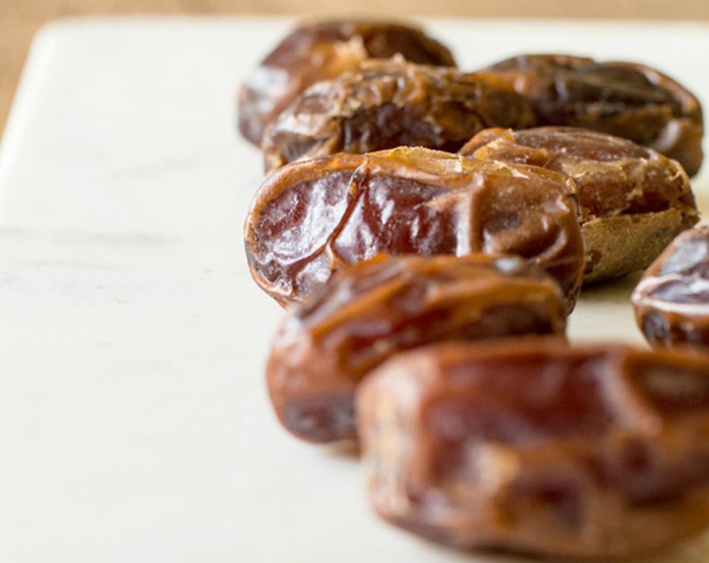 step 1 Add Peanut Butter (3/4 cup) and Dates (8) to a high-powered blender or food processor and process until smooth.