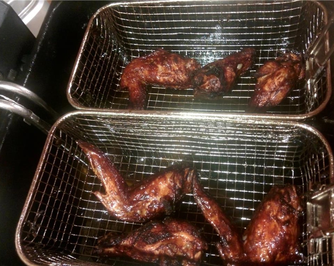 step 9 Cook the wings in small batches and make adjustments to the temperature as you see fit, just be sure to cook them to an internal temperature of 165 degrees F (75 degrees C).