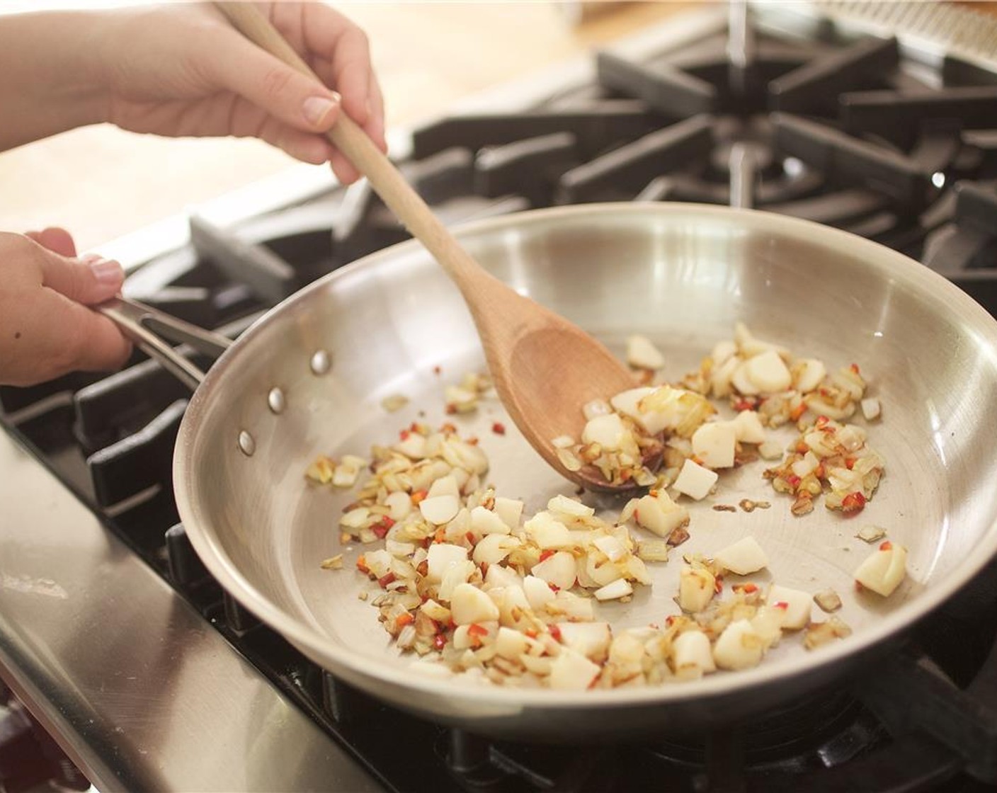 step 11 Add the quartered water chestnuts and cook an additional minute.