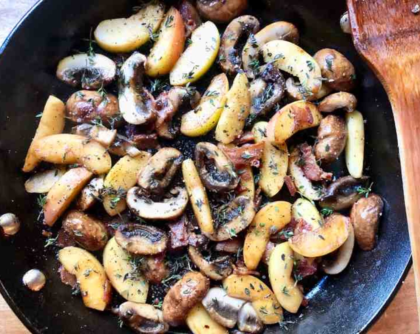 step 9 Next add the Cremini Mushrooms (2 1/4 cups), Honeycrisp Apples (2), and, if necessary, another drizzle of olive oll. Cook for about 5 minutes or until the mushrooms are golden and the apples soft. Add Fresh Thyme (2 Tbsp) and season with Kosher Salt (to taste) and Freshly Ground Black Pepper (to taste).