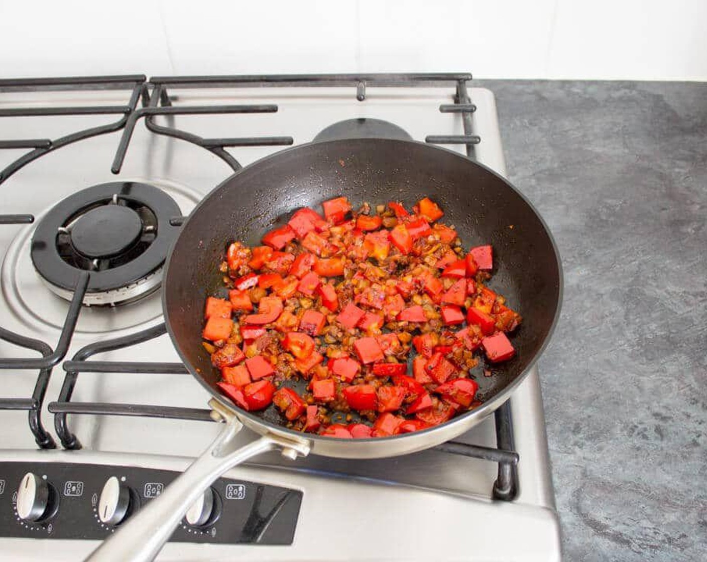 step 4 Add in Red Chili Pepper (1), Harissa Paste (2 Tbsp), and the Smoked Paprika (1/2 tsp) and give it a really good stir. Fry for approx 5 minutes until the pepper starts to soften a little.