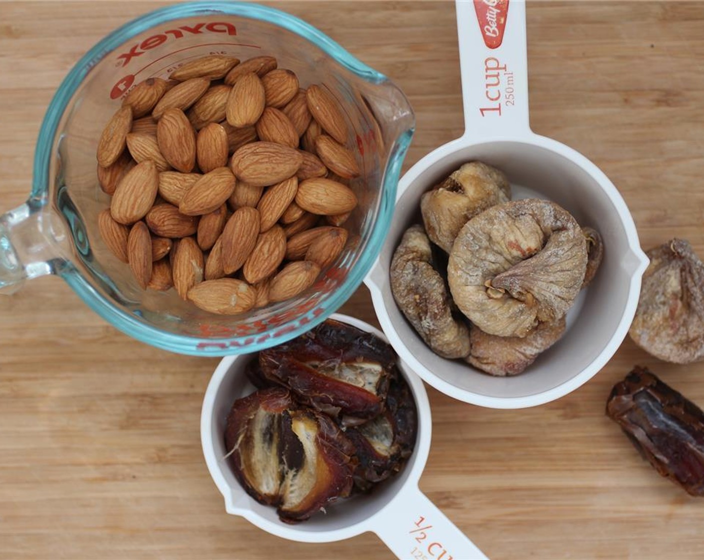 step 1 The Cashew Nuts (1 cup) must soak for at least 3 hours OR boiled for about ten minutes. You'll use them to make the creamy topping. Pit the Dates (1/2 cup).