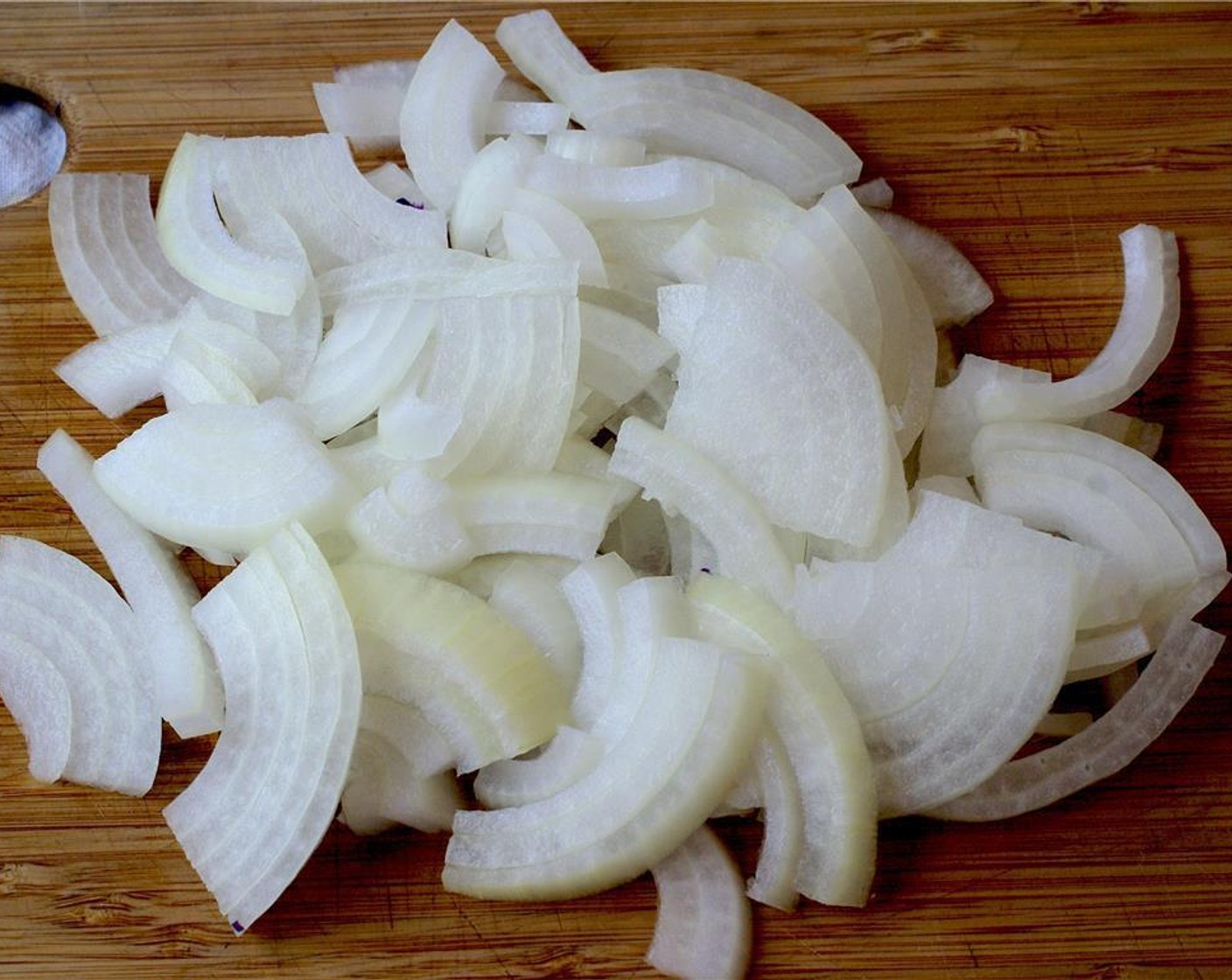 step 5 Cut each piece in half in the opposite direction and into thin slices. Add to a large pan.