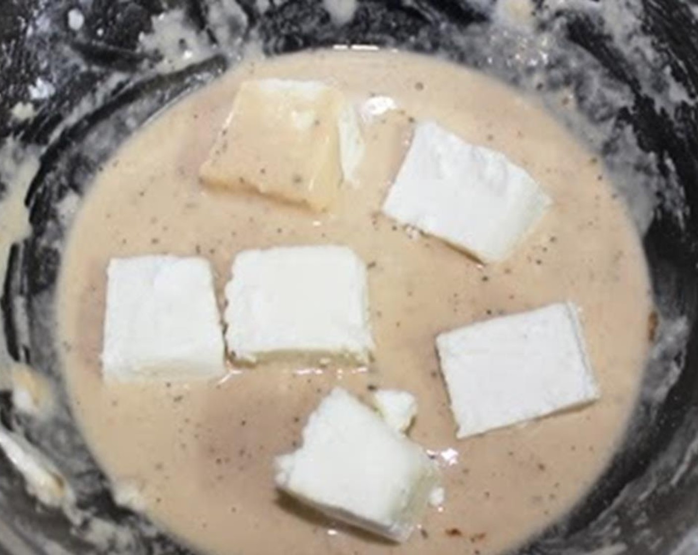 step 4 Coat the paneer lightly in the batter.