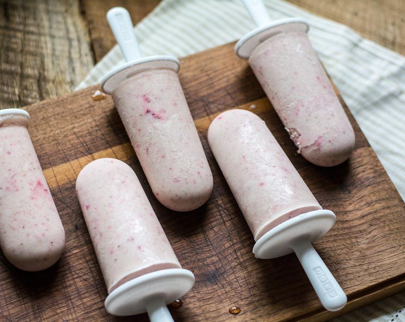 step 4 Evenly distribute strawberry banana cheesecake mix into six popsicle molds, add to freezer for 6-8 hours or until fully frozen. Serve and Enjoy