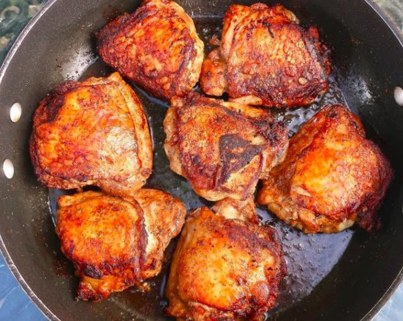 step 3 Heat Peanut Oil (as needed) in a skillet over medium-high heat until very hot. Place the chicken skin-side down until golden and crisp about 12 minutes, depending on the size of the thighs. Flip and cook the other side.