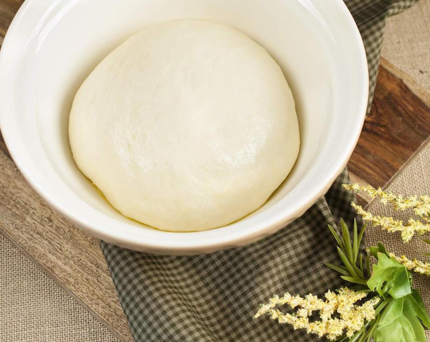 step 4 Turn out dough into a large greased bowl, cover and allow to rise in a warm, draft free area until double in size, about 1 hour.