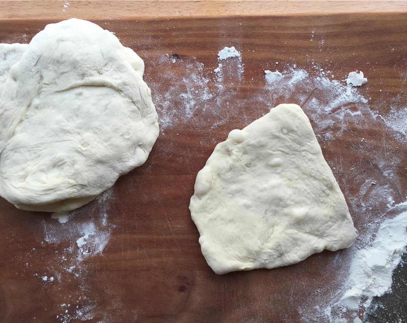 step 9 Use your hands to roll them out. You want them about a quarter-inch thick. Place the dough on squares of parchment paper, so they are easier to work with.