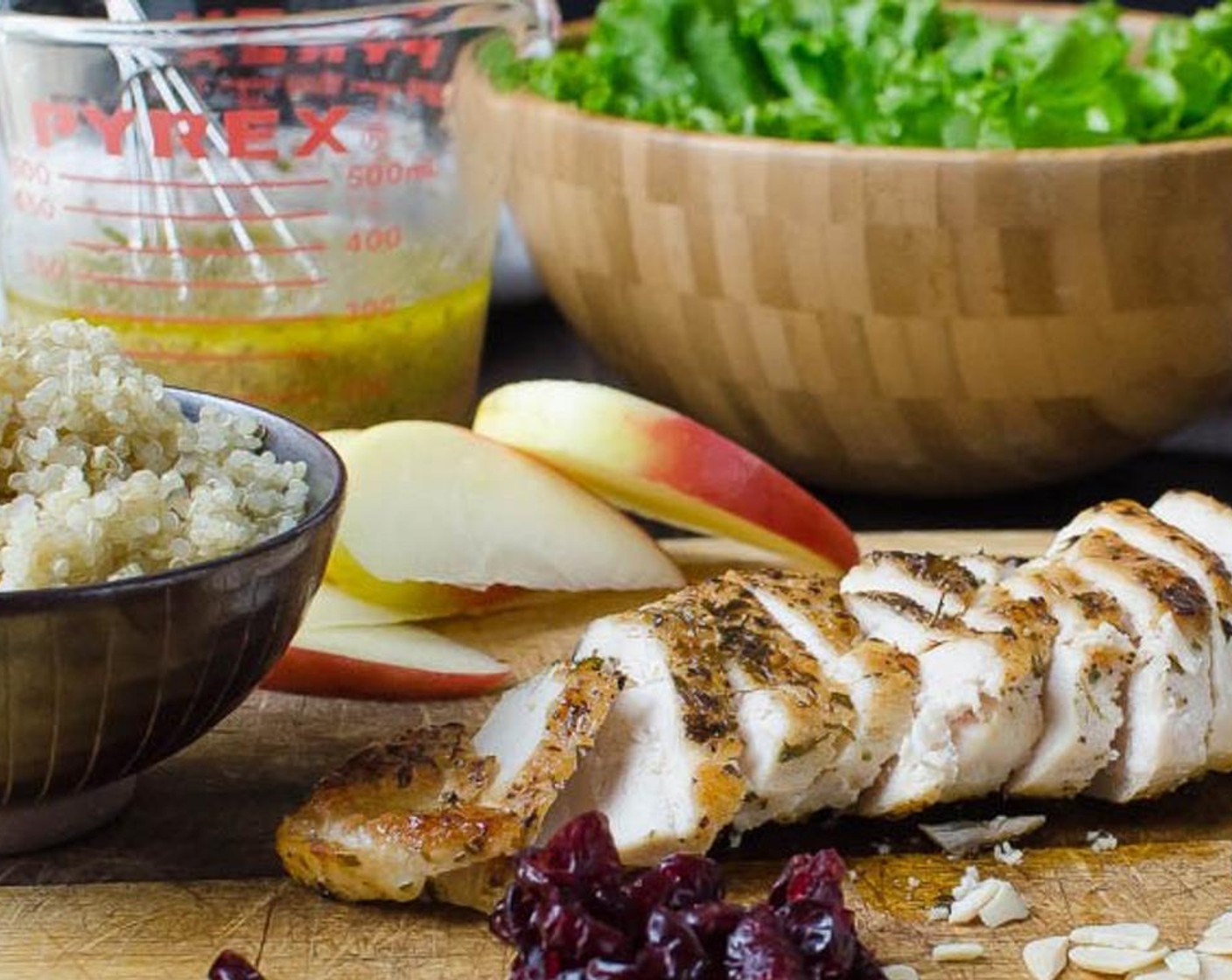 step 7 For the salad, combine torn Lettuce (4 cups), Quinoa (1 cup), and Apple (1) in a large bowl. Slice the chicken crosswise and rest it on top of the salad.