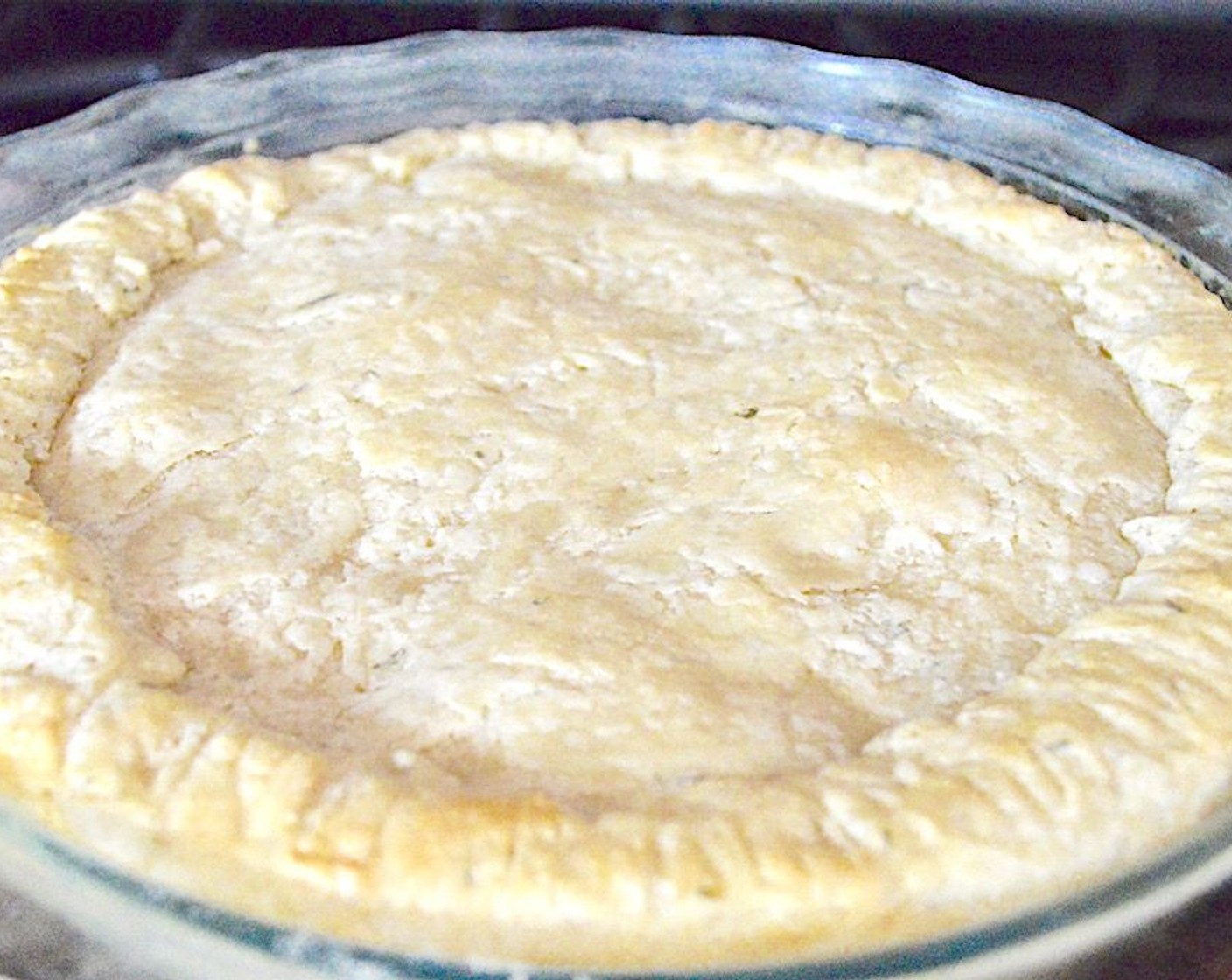 step 9 Use a fork to press the edges really firmly together and make them look nicer. Then brush the top all over with the Milk (1 Tbsp) Poke holes with the fork all over the top to vent the pie, then place it on a baking sheet to catch any potential bubbling over. It also makes it easier to take in and out of the oven.