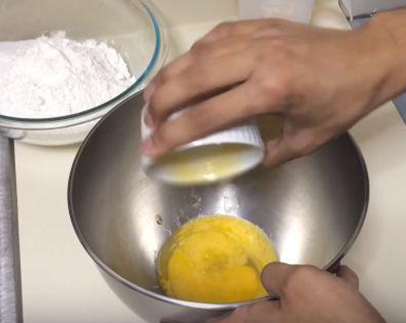 step 3 In another bowl, whisk together the Egg (1) and the Butter. Add the yeast-milk and beat together.