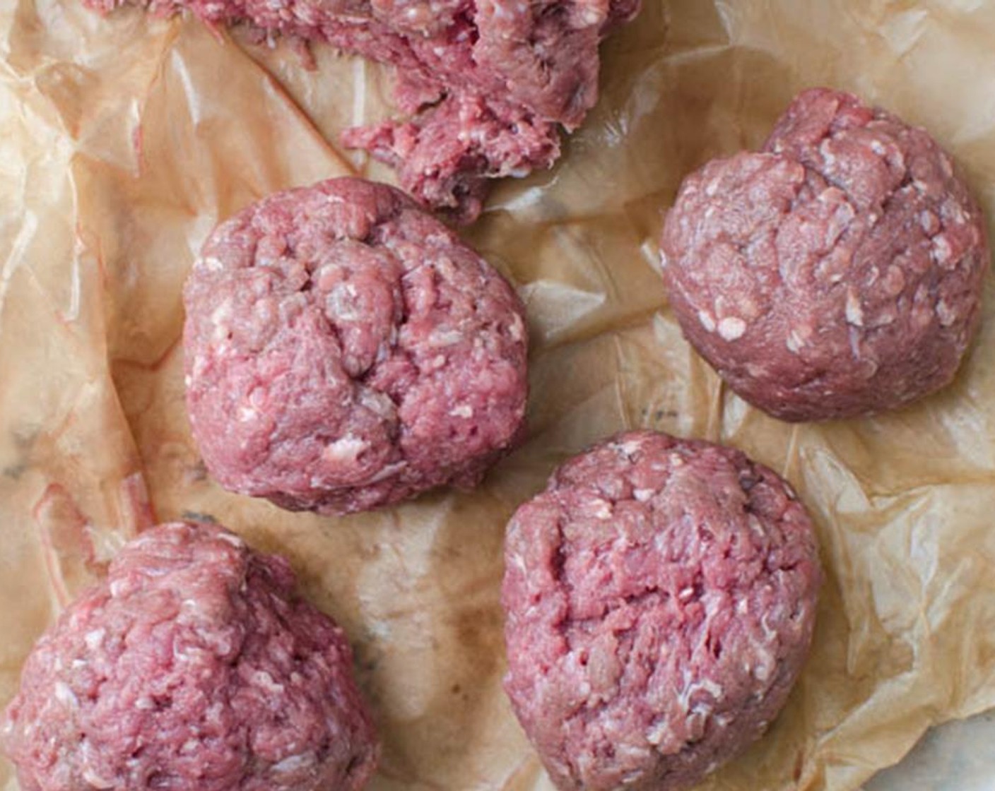 step 9 Divide the Ground Bison (2 lb) into 16 equal portions. Gently form them into balls, and make sure to not overwork the meat.