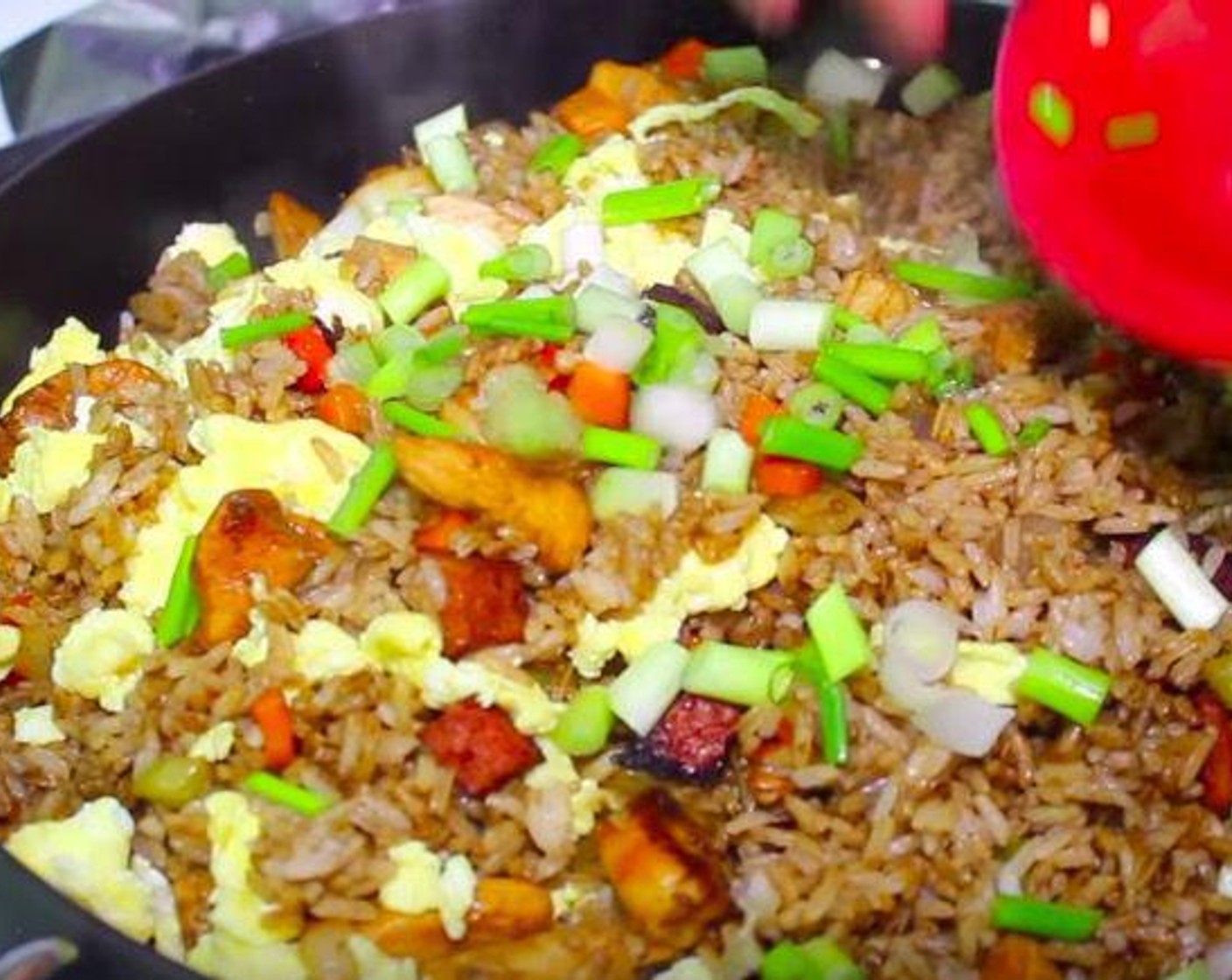 step 7 Add scrambled egg to the rice and toss to combine. Garnish with Scallion (1/4 cup) and serve.