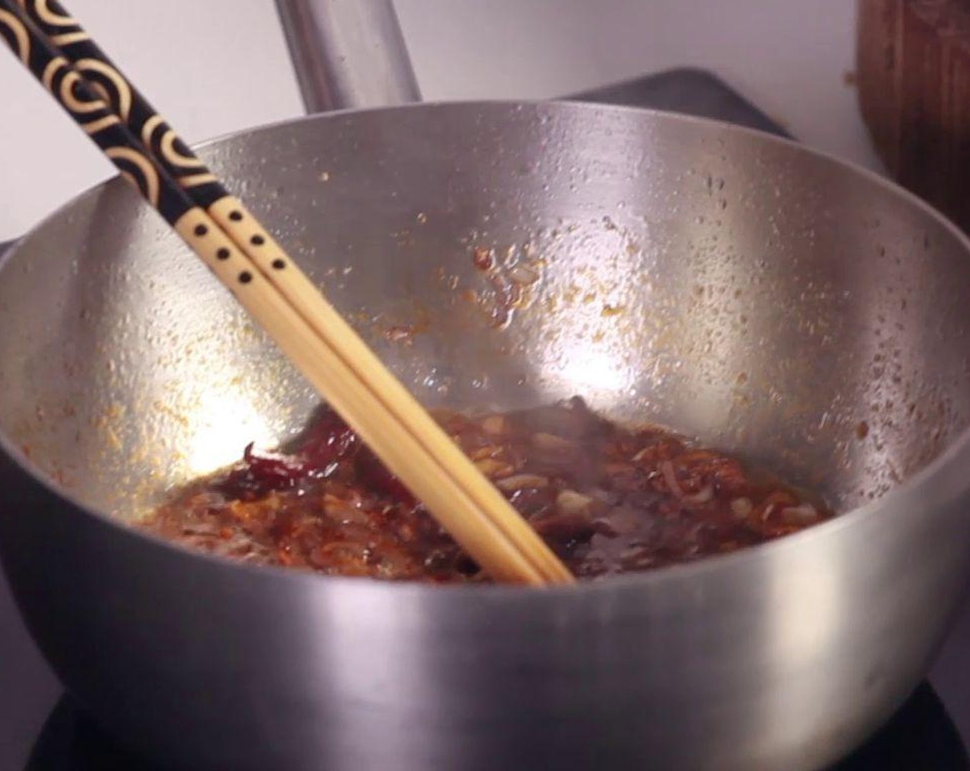 step 2 Fry Duck Fat (1/2 cup) in a hot pot, add Granulated Sugar (1 Tbsp), Garlic (1 clove), Onions (2), Fresh Ginger (1 Tbsp), Chili Peppers (5), and Star Anise (3).