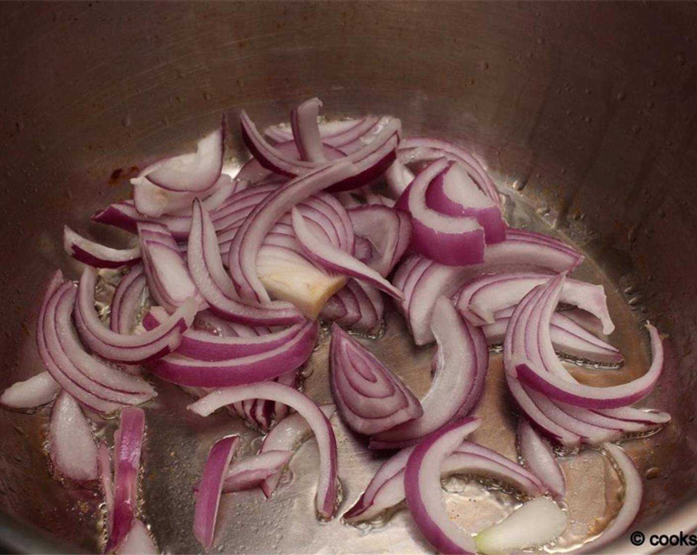 step 7 Heat the remaining Oil (1 1/2 Tbsp) and sauté onion (1/2 cup) until cooked.