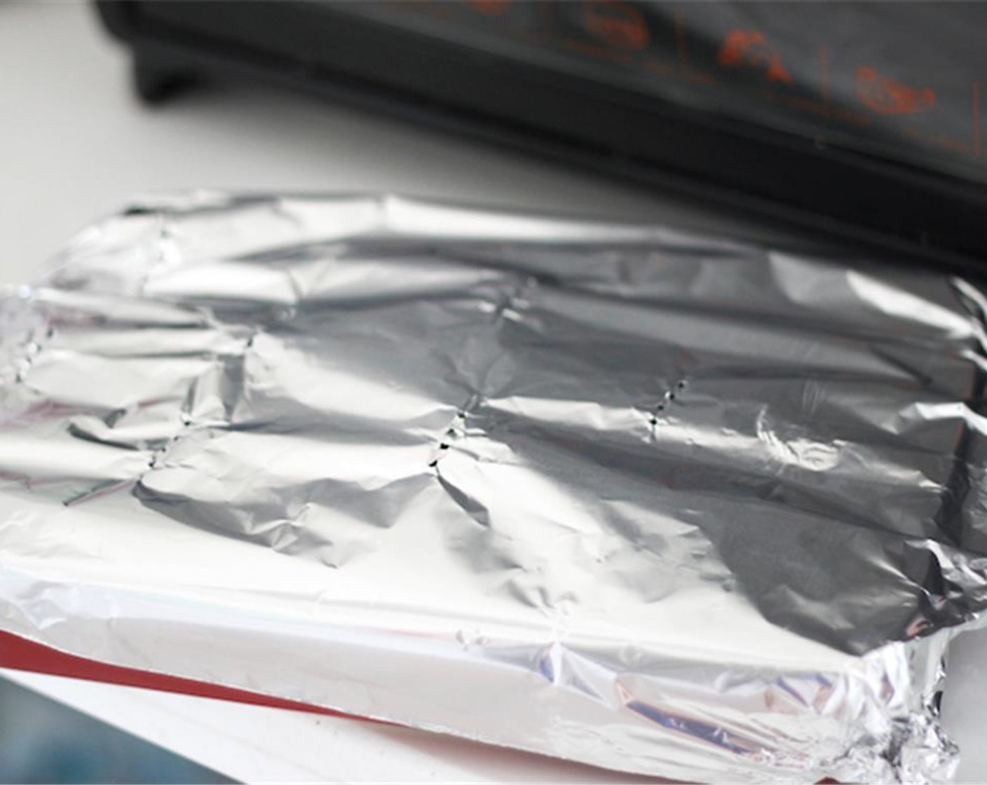 step 11 Your oven should be preheated by now. Cover the pan with foil and bake in the oven for 45 minutes. Also, make some holes on the foil so it can breathe.