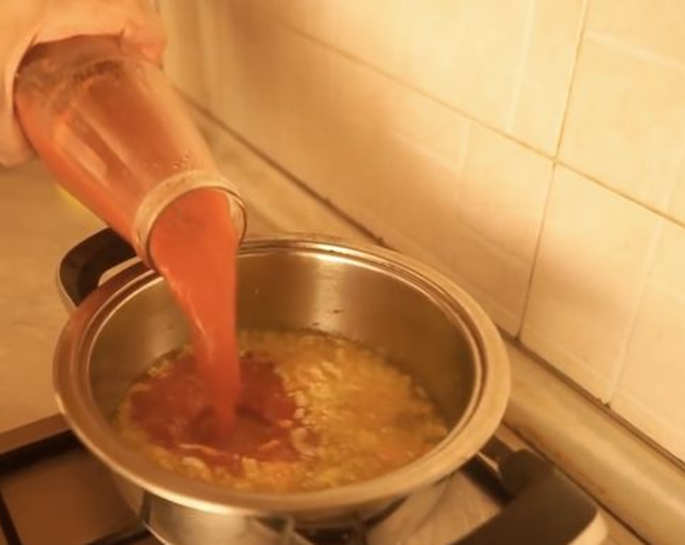 step 6 Once carrot and onion start to brown, add the Tomato Passata (1 bottle) a pinch of Sea Salt (to taste), Fresh Basil Leaves (to taste), and simmer for 30 minutes.