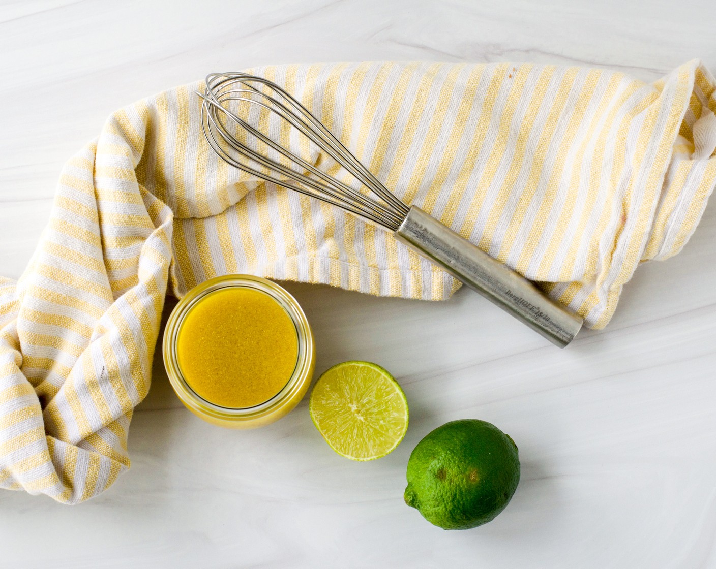 step 1 To make the dressing, combine the Mango-Peach Preserves (2 Tbsp), White Wine Vinegar (2 Tbsp), Lime (1), and Dijon Mustard (1 Tbsp) together in a small bowl and whisk to combine. While whisking, slowly pour in the Extra-Virgin Olive Oil (1/4 cup) and whisk until emulsified. Season with Salt (to taste) and Ground Black Pepper (to taste) and set aside.