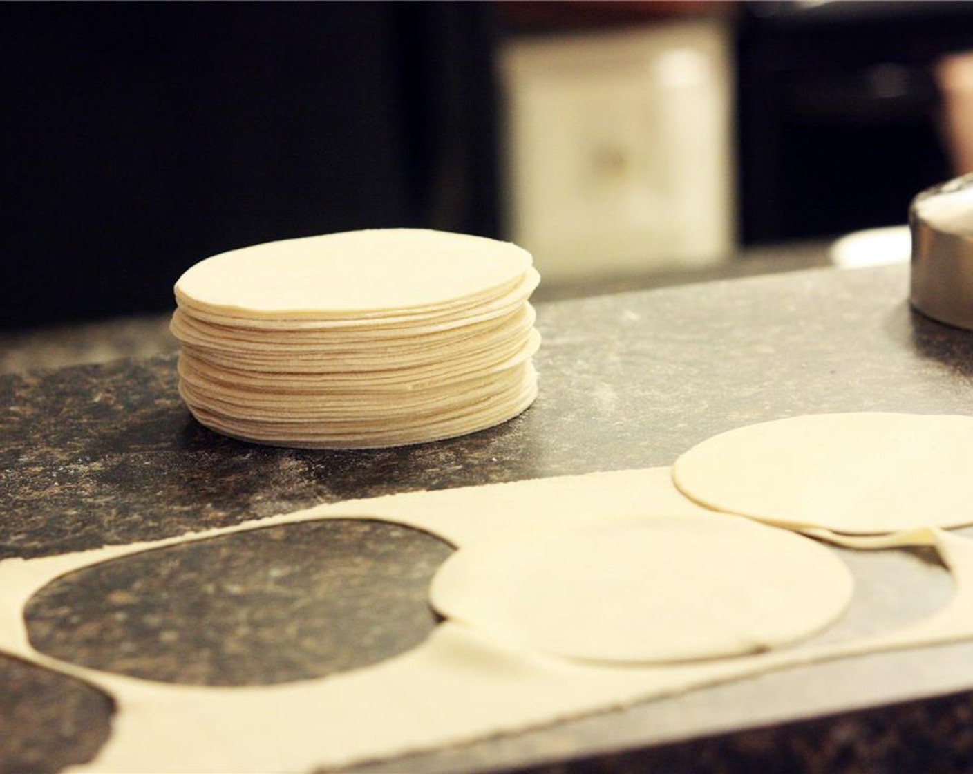 step 6 Use a round cookie cutter or biscuit cutter about 3 inches in diameter to cut out your wrappers. Dust each side generously with flour, which will allow you to stack the wrappers without them sticking.