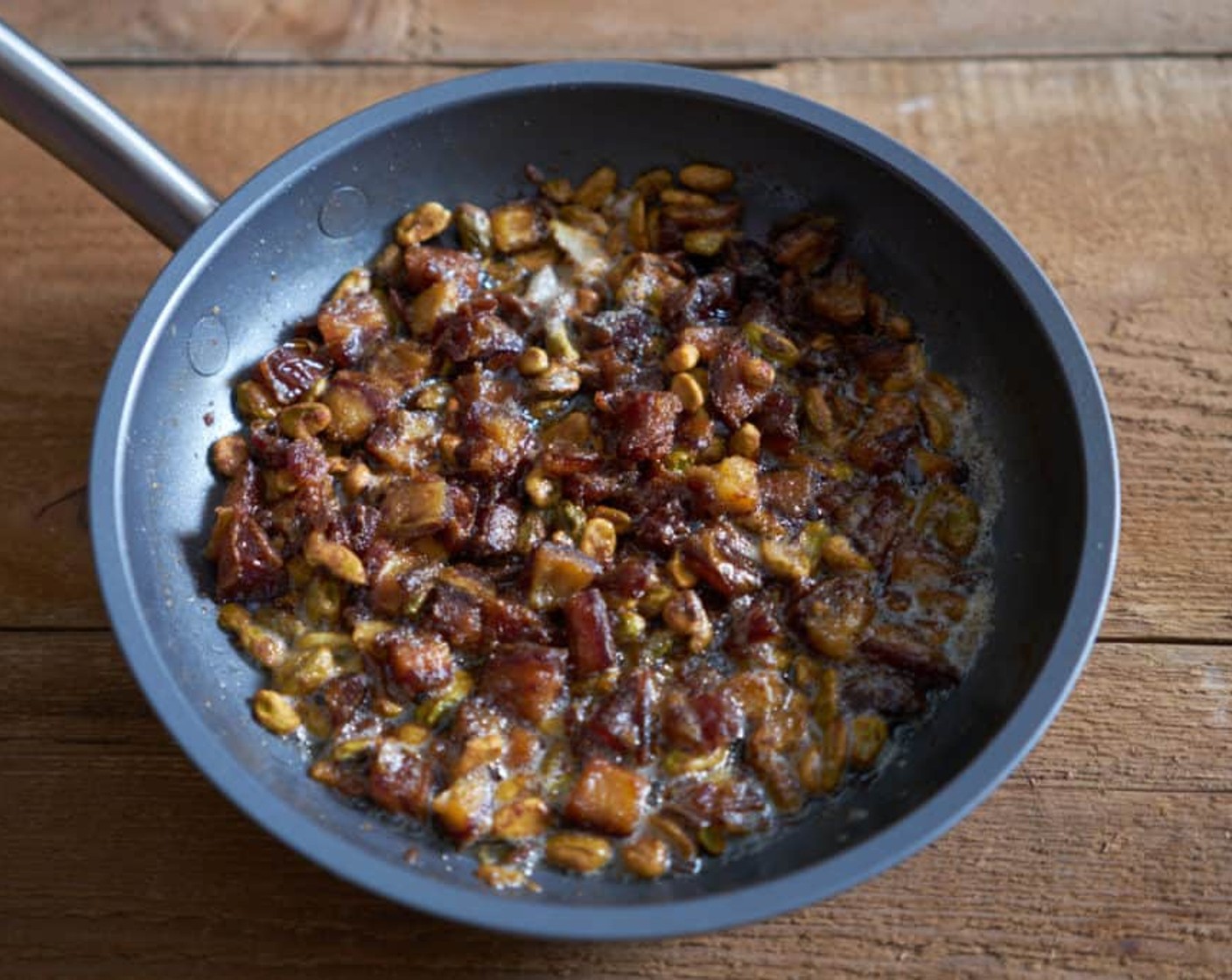 step 7 Heat the Unsalted Butter (3 Tbsp) in a small skillet over medium heat. When it begins to foam, add the dates and Pistachios (1/3 cup). Cook for 3-4 minutes until the pistachios are browned and toasted and your whole kitchen smells like date butter!