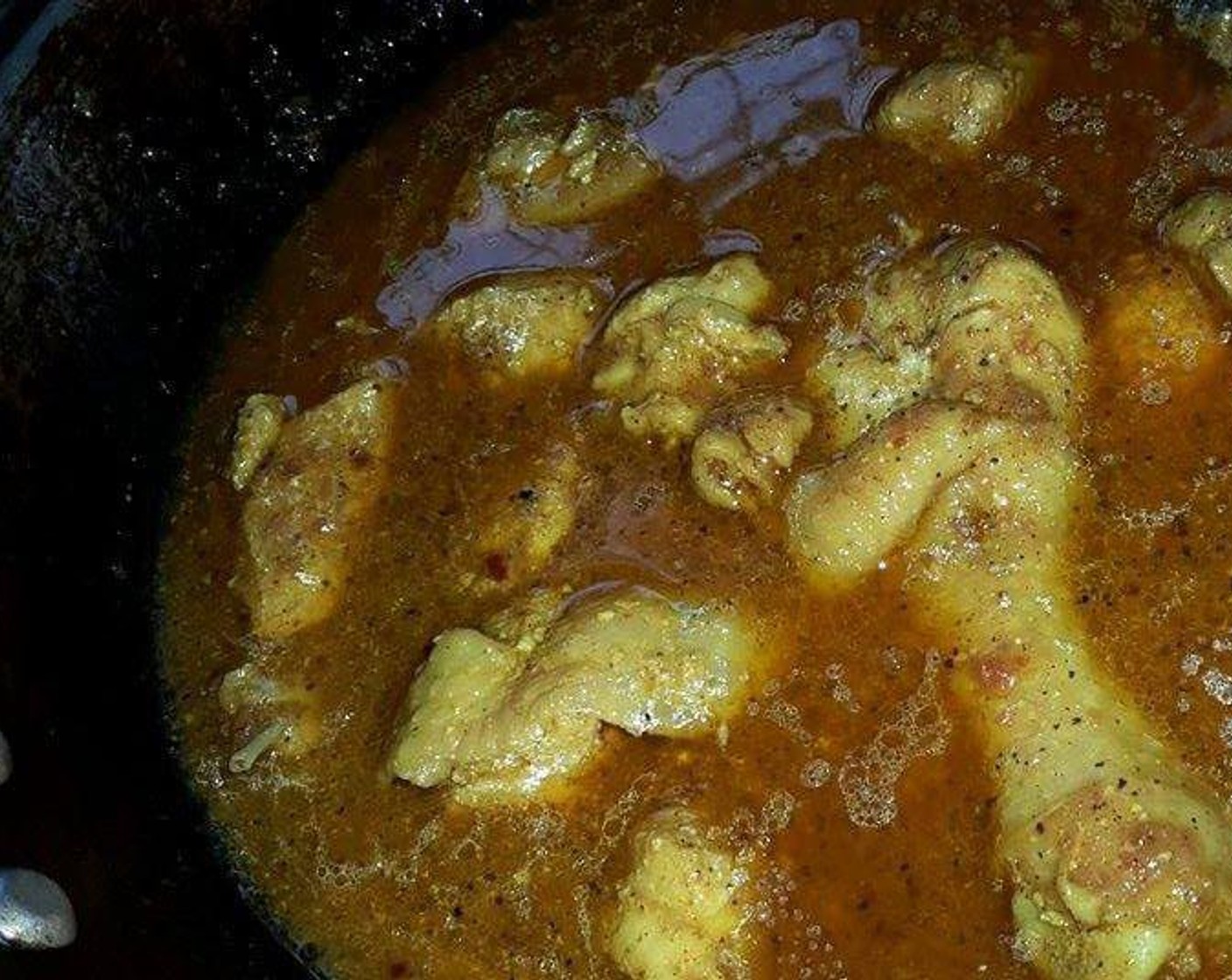 step 10 Then add the cooked chicken pieces into above paste and add half a cup of chicken stock, remaining water in which chicken is cooked. Reduce heat to a simmer and cook until chicken is tender - most of the liquid will have dried up.