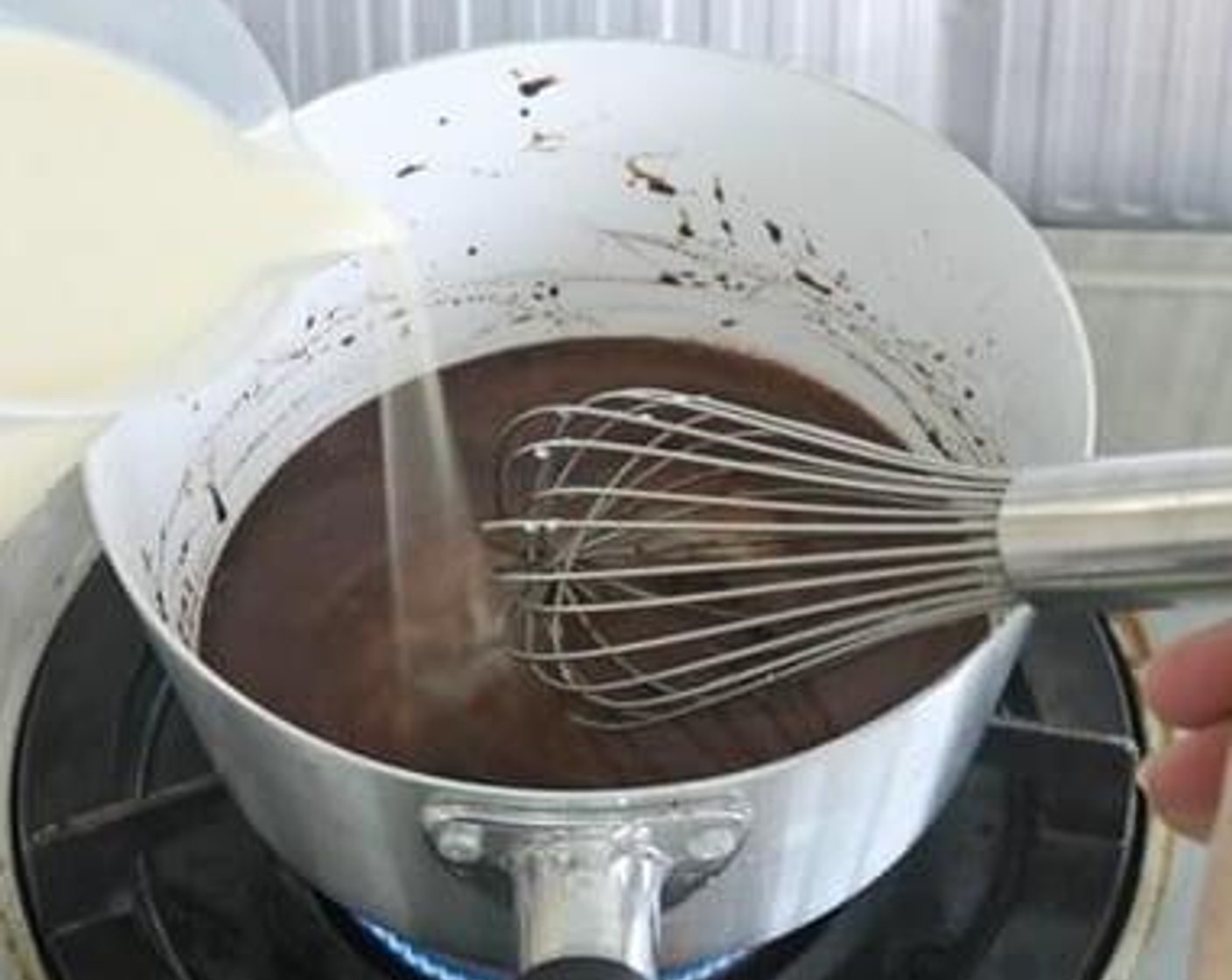 step 2 Gradually pour in Milk (2 1/4 cups) and Vanilla Extract (1 tsp), stir well again. Under medium heat, bring milk mixture to a boil.