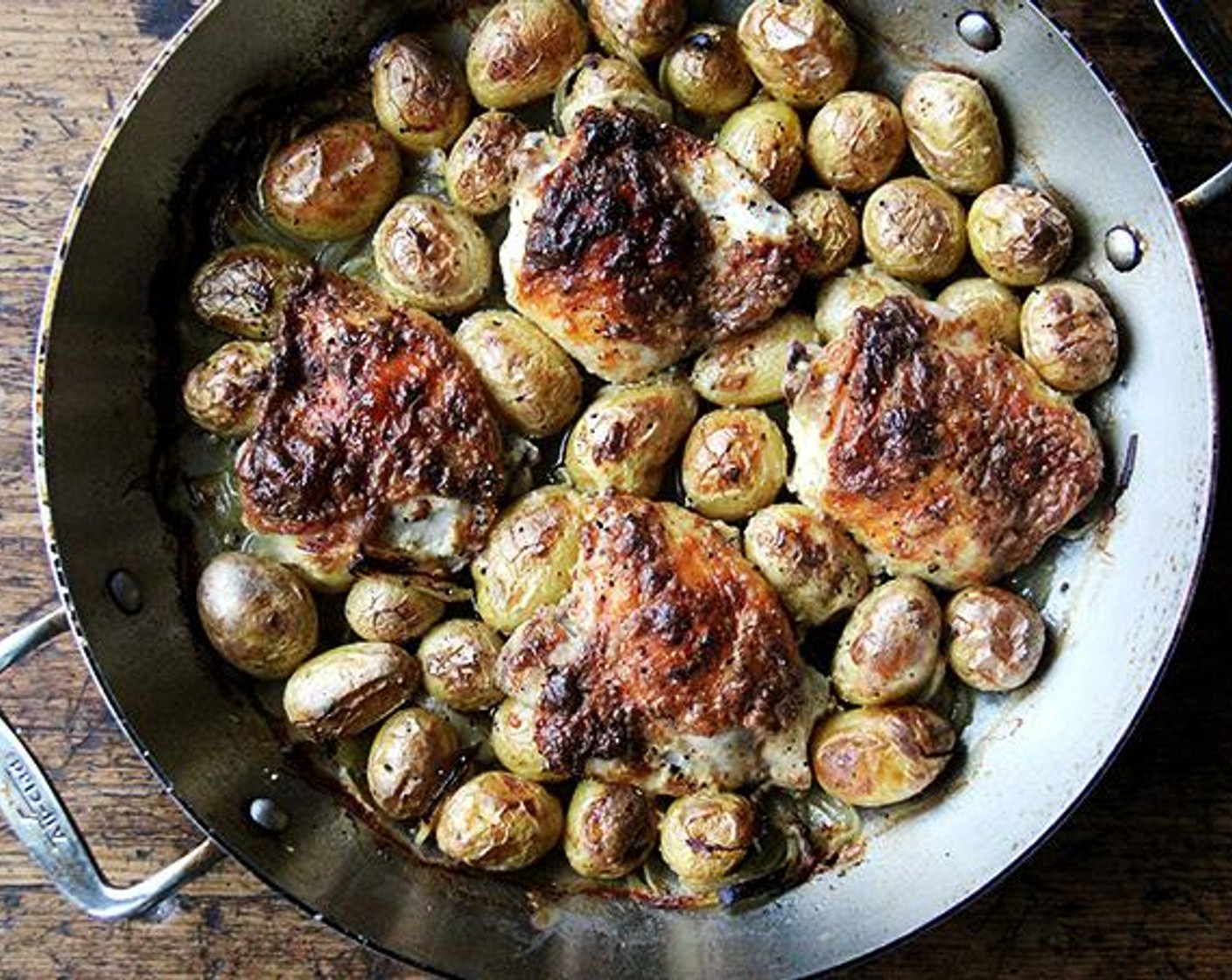 step 5 Transfer pan to the oven uncovered and cook for 45 minutes or until evenly golden, checking after 30 minutes to ensure everything is browning evenly — if the onions are getting too dark, add a few more tablespoons of water to the pan.