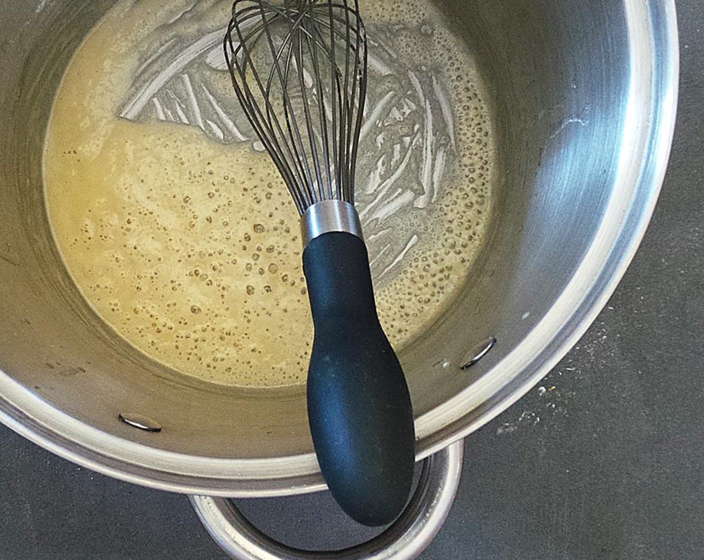 step 4 In a heavy bottom sauce pan, melt the Butter (2 1/2 Tbsp) over medium heat. Add the All-Purpose Flour (1/4 cup) and mix with a wooden spoon. Cook for about 2 minutes or until the roux smells like butter. If you're using whole butter, wait a few seconds until the butter stops bubbling. This means all the water is gone!