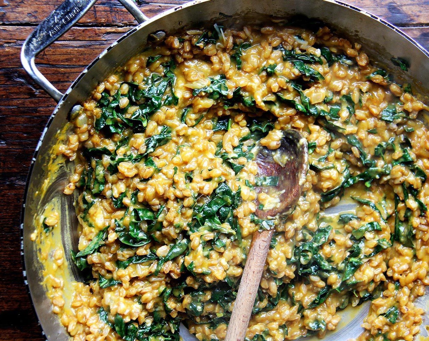 step 10 Stir one cup of the squash purée into the risotto. Add a handful of the thinly sliced kale strips and stir until the kale is wilted. Add more kale to taste — a small handful was enough for me, but add as much as you like. Add the remaining Butter (2 Tbsp) and the Parmigiano-Reggiano (1 cup). Stir, taste, adjust seasoning, and serve.