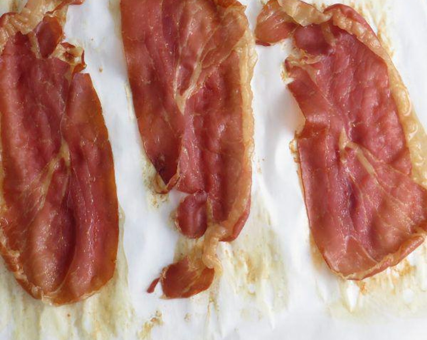step 2 Line a baking sheet with parchment paper and arrange Prosciutto (4 slices) in a single layer. Bake for 10-12 minutes, until prosciutto is crispy. Remove from oven to cool.