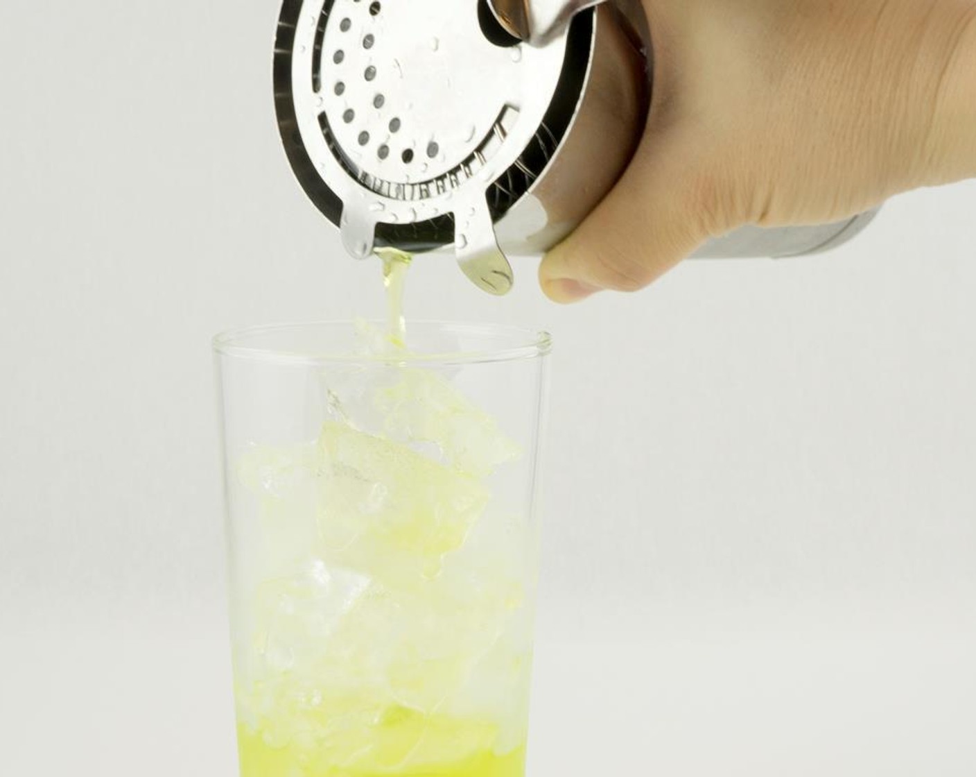 step 5 Strain into a Collins glass filled with ice.