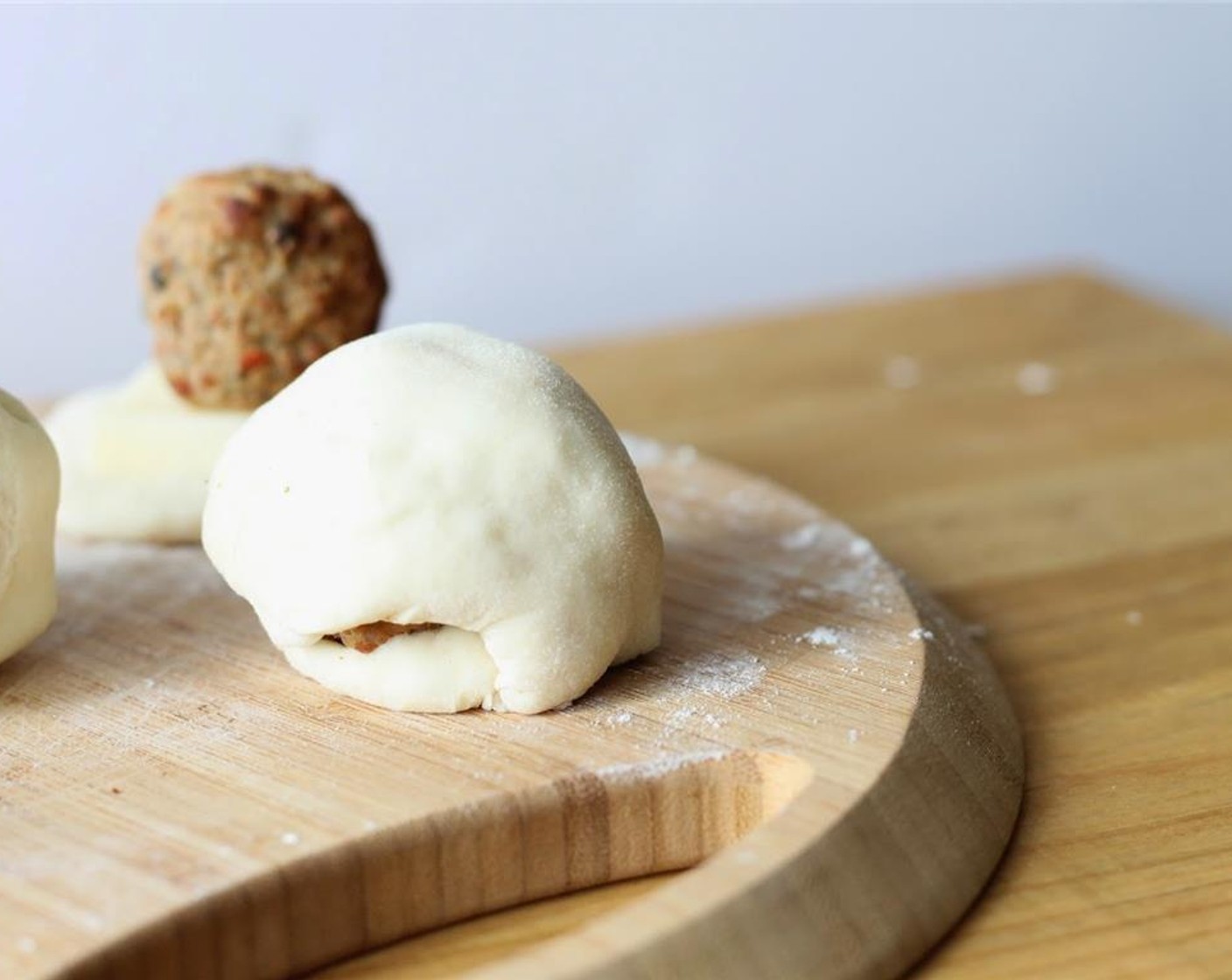 step 4 Squeeze dough together at the seems, to form a dough ball.